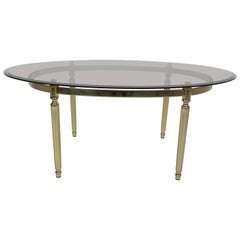 French Hollywood Regency Smoked Glass and Brass Oval Cocktail Table, 1970s