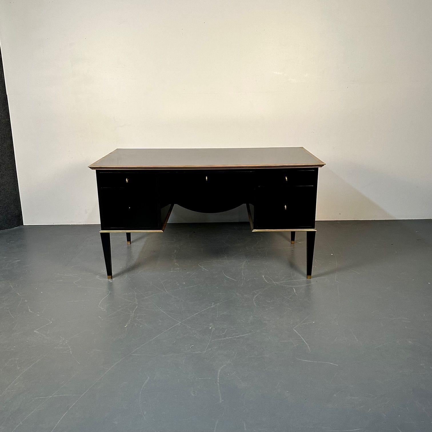 French Hollywood Regency Style Ebony Lacquer Executive Desk / Writing Table
 
A spectacular Executive Desk that can sit Center of any room or office. The finest ebony finish having bronze framing throughout. Three drawers over two large deep drawers