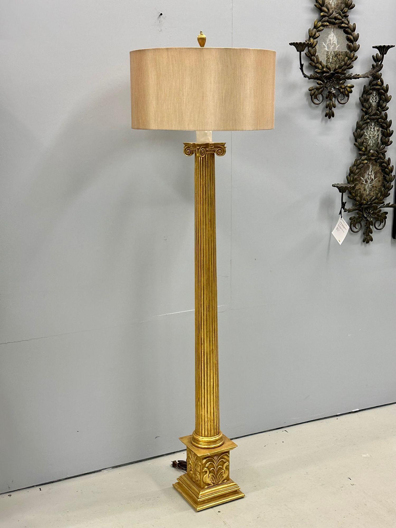 French Hollywood Regency Style Large Giltwood Floor Lamp, Hand Carved
 
Louis XVI style floor lamp having a recessed circular body on top of an intricately hand carved square base depicting doves and flowers. Sold with shade.
 
68 5/8H x 8.25W x