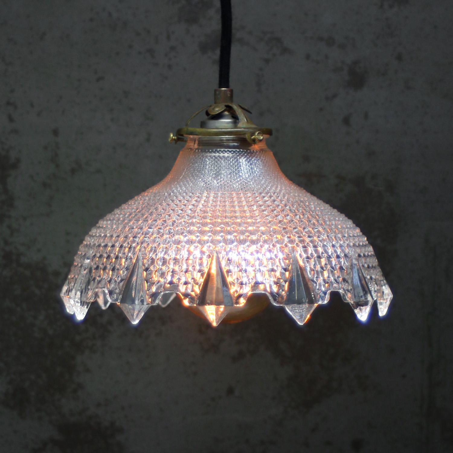 French Holophane glass pendant lights
Brass top with glass shade.

Weight: 1.20 kg / 2.6 lb

Priced per individual item. All lamps have been made suitable by international standards for incandescent light bulbs, energy-efficient and LED bulbs.