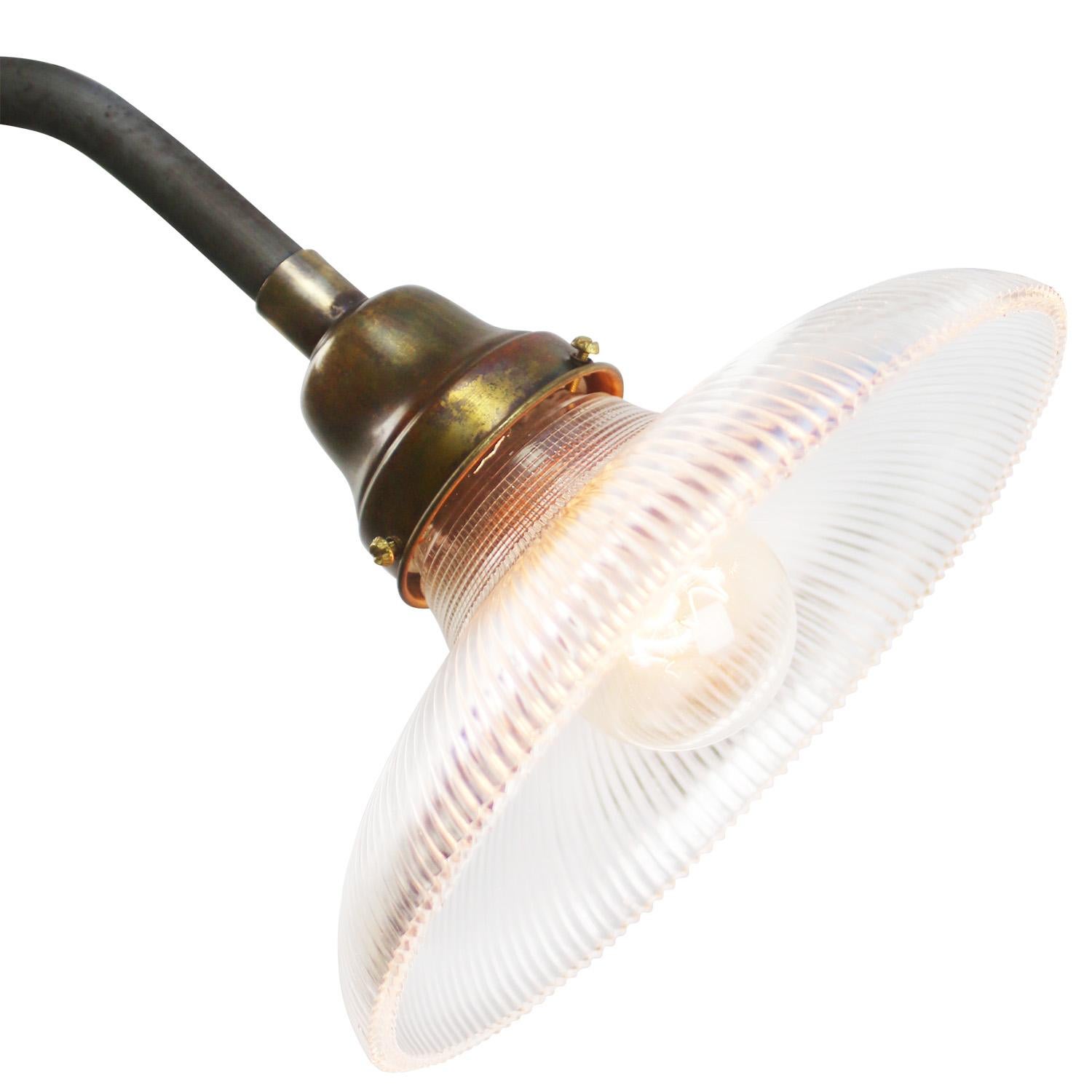 Holophane glass cast iron industrial scone wall light.
Cast iron with brass top, clear striped glass.

Diameter cast iron wall mount: 10.5 cm / 4”
2 holes to secure.

Weight: 2.00 kg / 4.4 lb

Priced per individual item. All lamps have been made