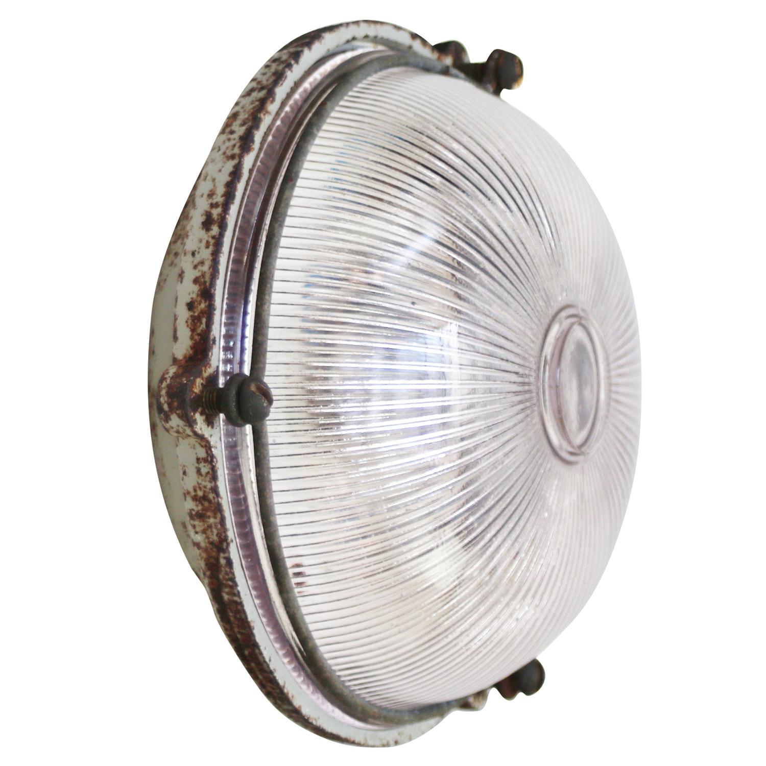 French Industrial wall / ceiling lamp by Mapelec, Amiens, France
Cast Iron back with clear striped glass.

Weight 2.60 kg / 5.7 lb

Priced per individual item. All lamps have been made suitable by international standards for incandescent light