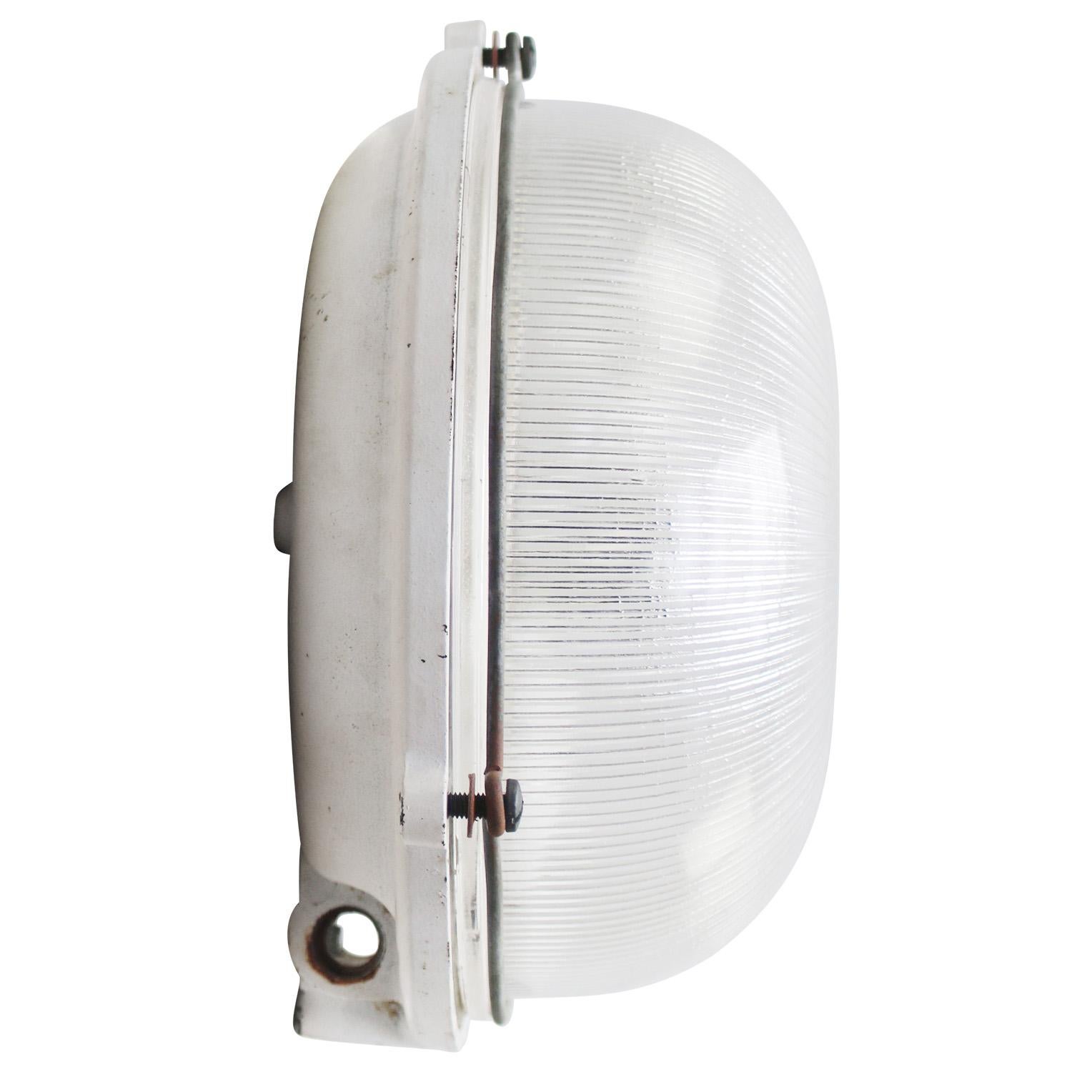 French Industrial wall / ceiling lamp by Mapelec, Amiens, France
Cast Iron back with clear striped glass.

Weight 3.50 kg / 7.7 lb

Priced per individual item. All lamps have been made suitable by international standards for incandescent light