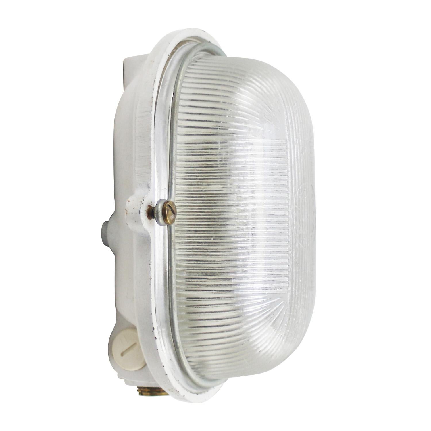 French Industrial wall / ceiling lamp by Mapelec, Amiens, France
Cast Iron back with clear striped glass.

Weight 1.80 kg / 4 lb

Priced per individual item. All lamps have been made suitable by international standards for incandescent light bulbs,