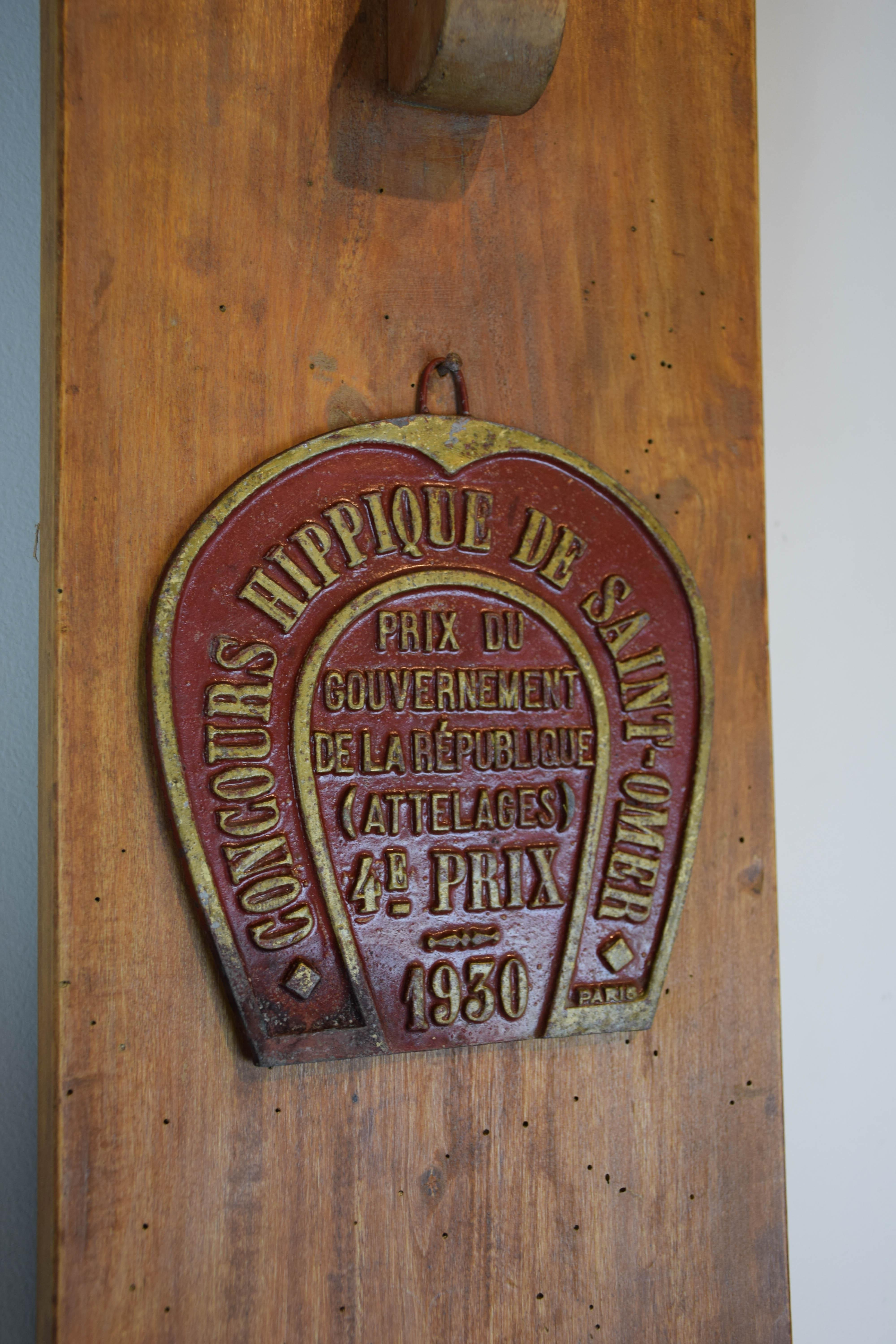 We found this horse tack rack on an old horse farm in the south of France. The metal trophy plaque is not original to the piece, the previous owner added the plaque for decoration and memories of past trophies won. A wonderful piece for the