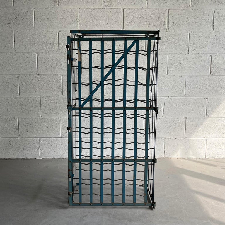 Classic, French, midcentury, industrial, painted steel, caged wine rack by Rigidex Deposé features a 50 bottle capacity with lockable latch.