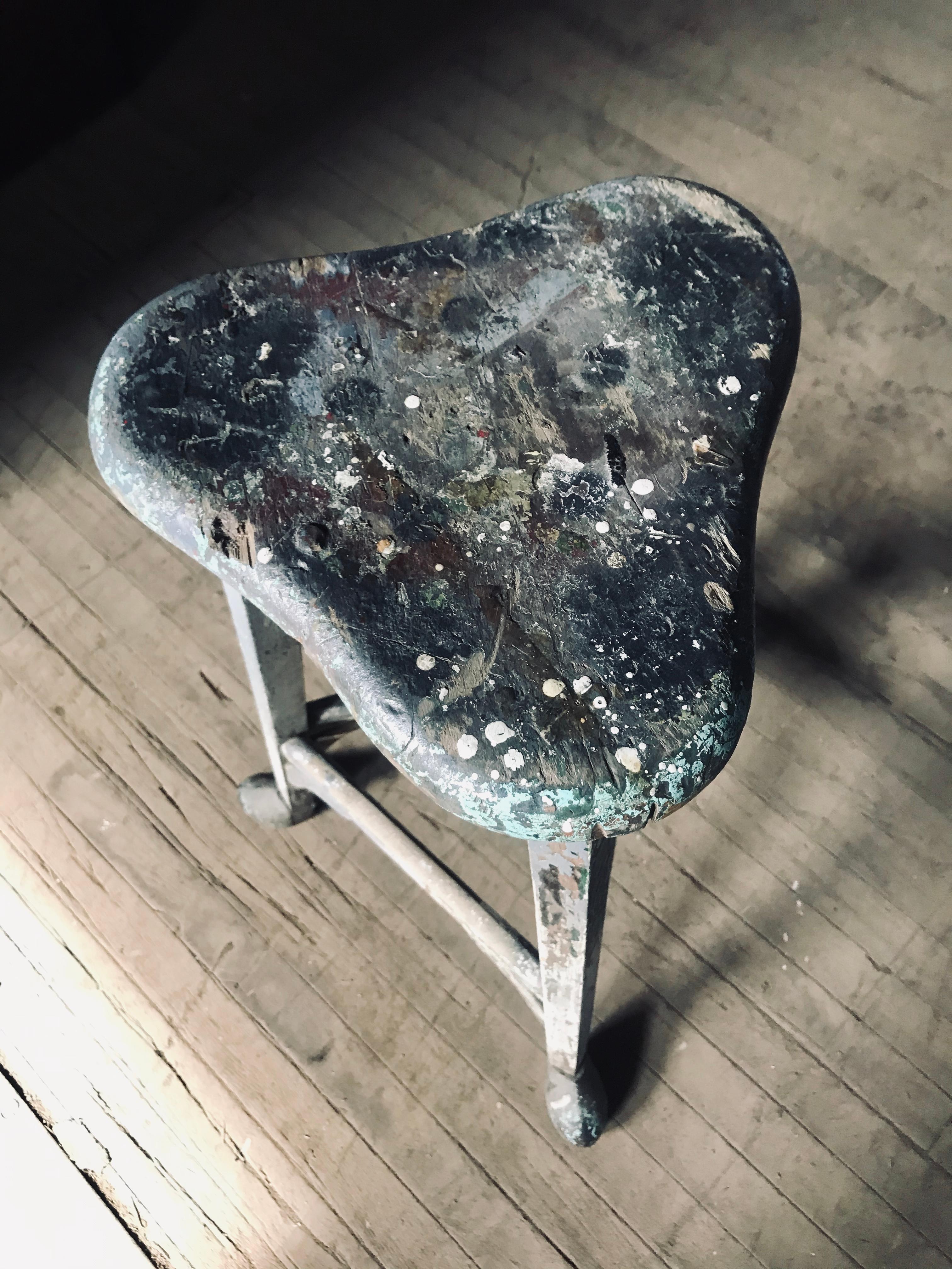 Turn of the century industrial stool, French Modernist, All original color, paint surface, metal capped hoofed feet, stunning accent piece, work stool, task stool, artist stool, functional sculpture. Measures: 12