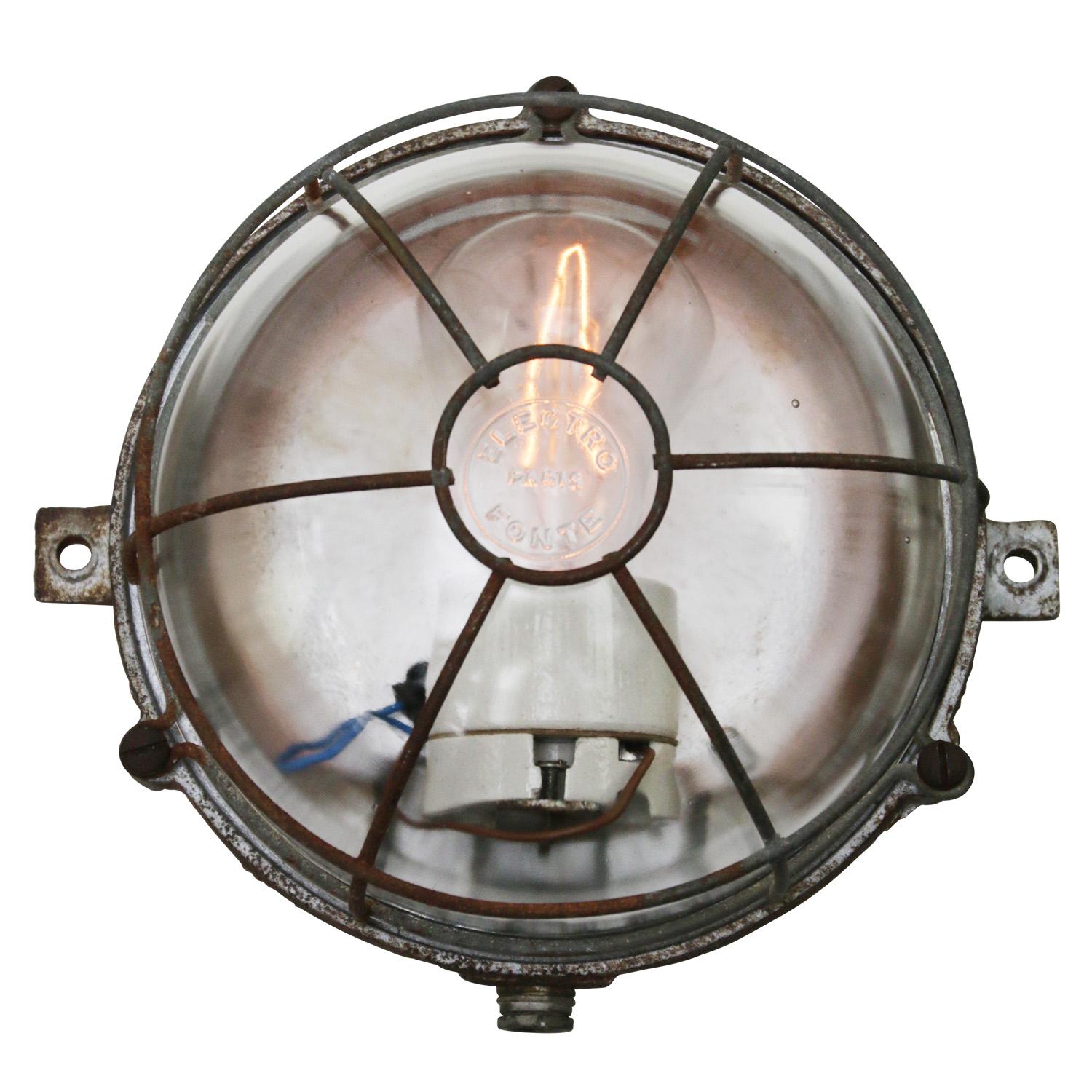 French Industrial wall / ceiling lamp by Electro Fonte Paris, France
Grey cast iron back with clear glass.

Weight: 2.10 kg / 4.6 lb

Priced per individual item. All lamps have been made suitable by international standards for incandescent