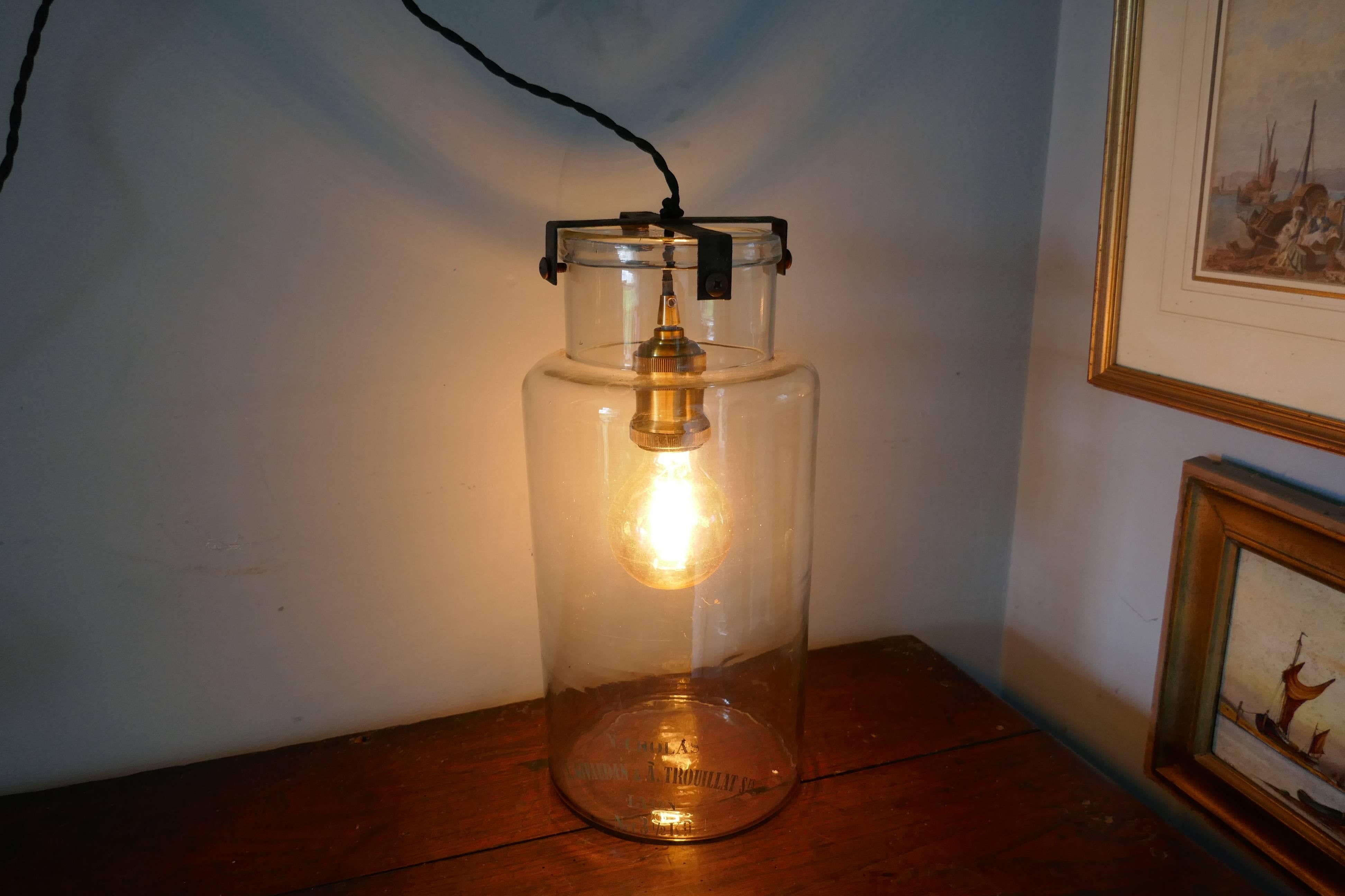 French Industrial lamp retro design

The lamp has been made from an Industrial glass Jar, dating back to the 19th Century which has been wired and fitted with an Edison light bulb
The heavy glass jars is 14.5 “ tall and 7” in diameter, 
There