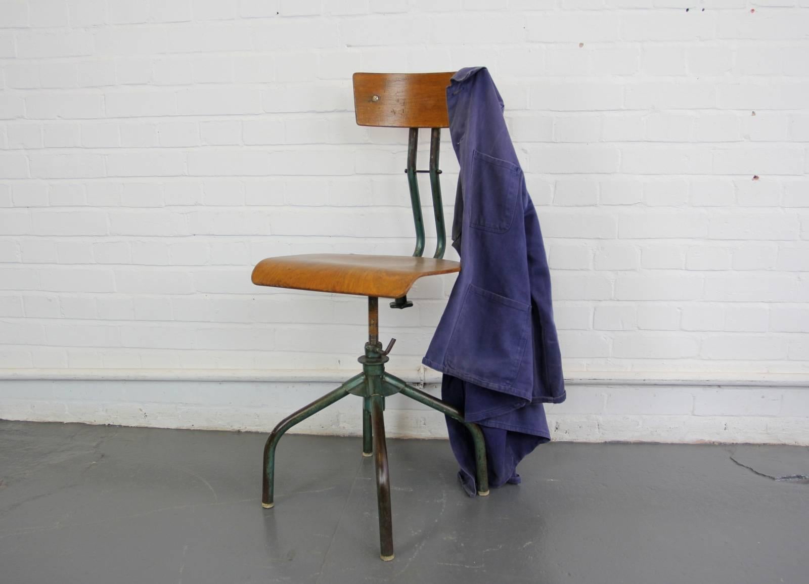 French industrial machinists chair, circa 1950s

Product code #OA515

- Height adjustable
- Sprung seat and backrest
- Shaped ply seat and backrest
- Swivels 360
- French, circa 1950s
- Measures: L 38cm wide x 45cm deep x 96cm tall
- 56cm