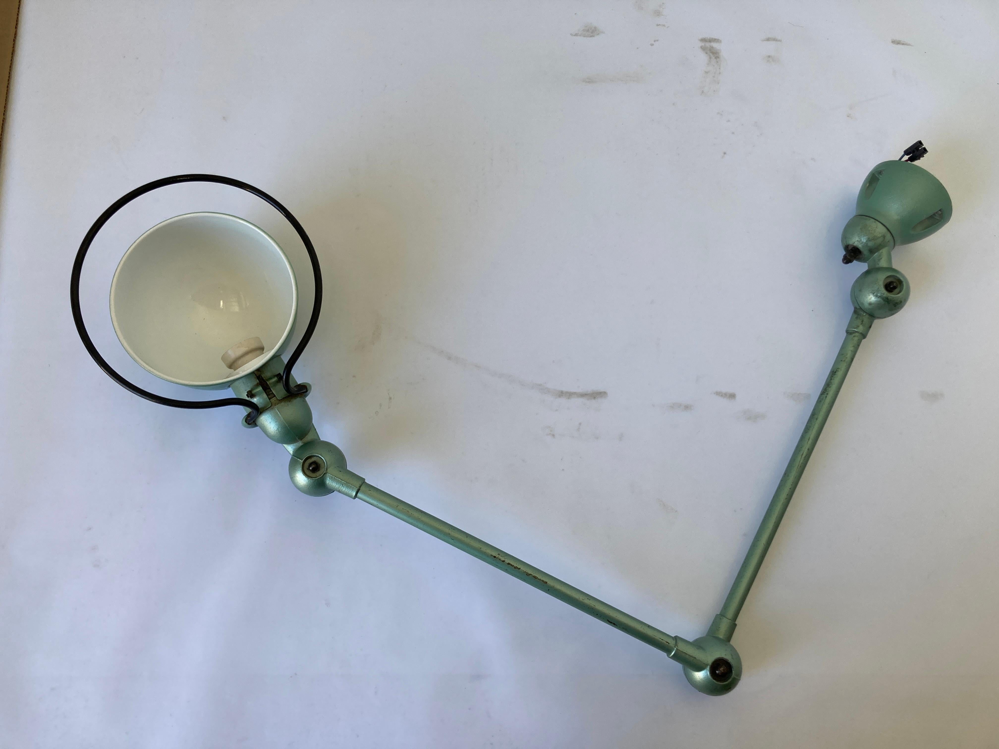 Vintage Jielde factory lamp from France, made in Lyon.
French Industrial Metal Lamp by Jean-Louis Domecq for Jielde Factory.
Circa 1940 -1950.
Original Jielde task lamps with clamp holders.
Adjustable at all joints, green plate edition, switch on