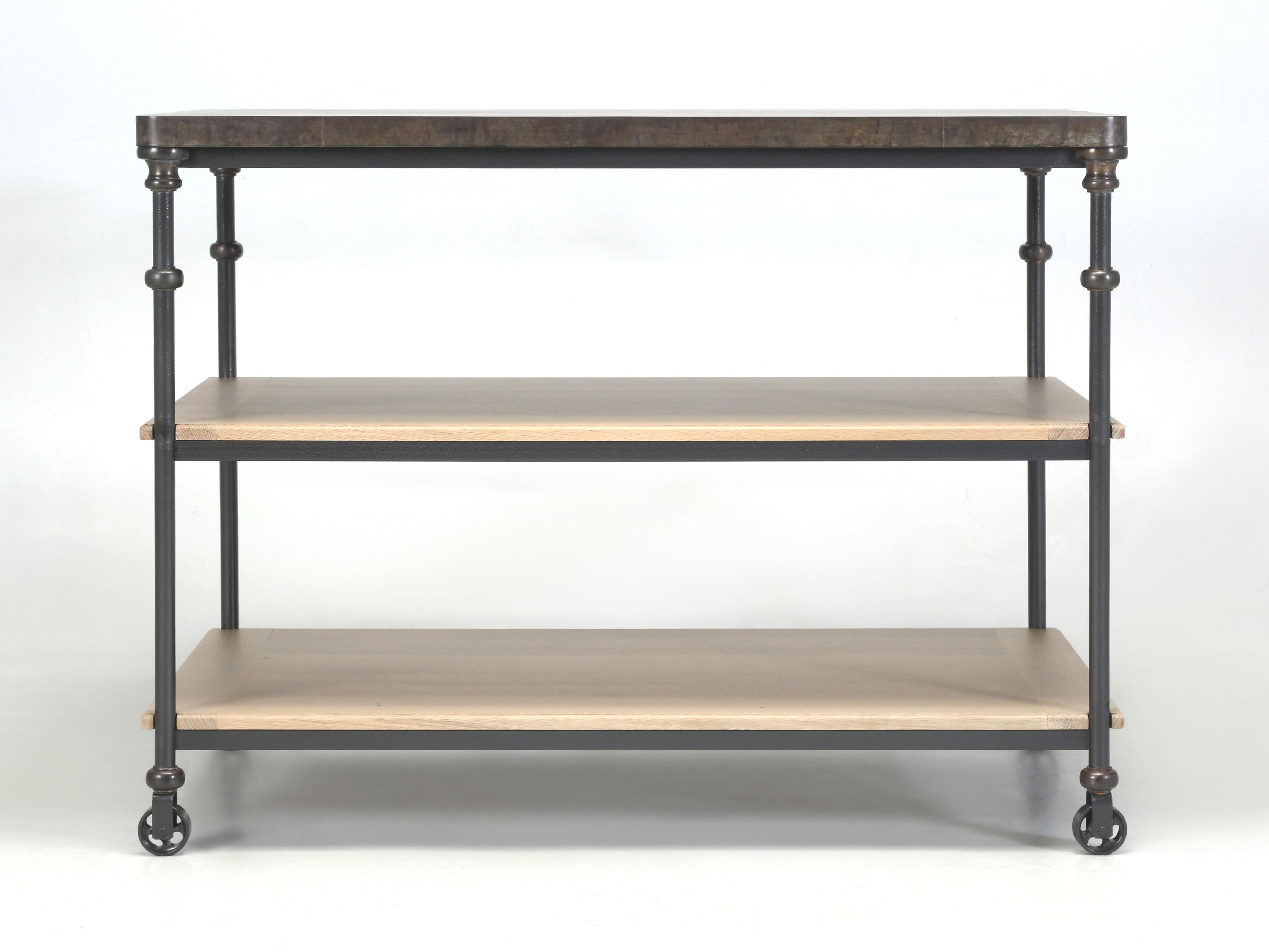 French Industrial Inspired Kitchen Island Made in Chicago by Old Plank and available in any dimension, top material and numerous metals for the base and donut shaped connectors. We have been making Country French or European Industrial Inspired