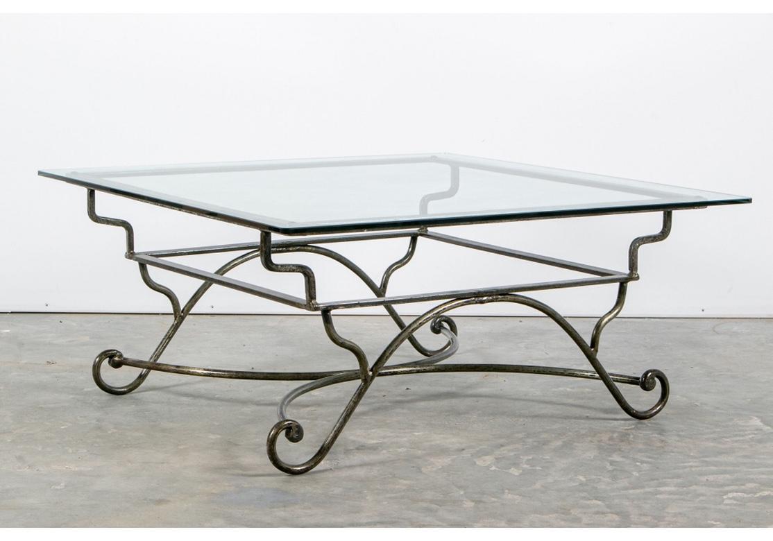 A steel base table with tiered square frame, shaped legs and scrolled feet. Having an X-stretcher base, good proportions and weight, all in a natural steel finish with some added paint accents.
Frame measures 35 1/2 x 35 1/2