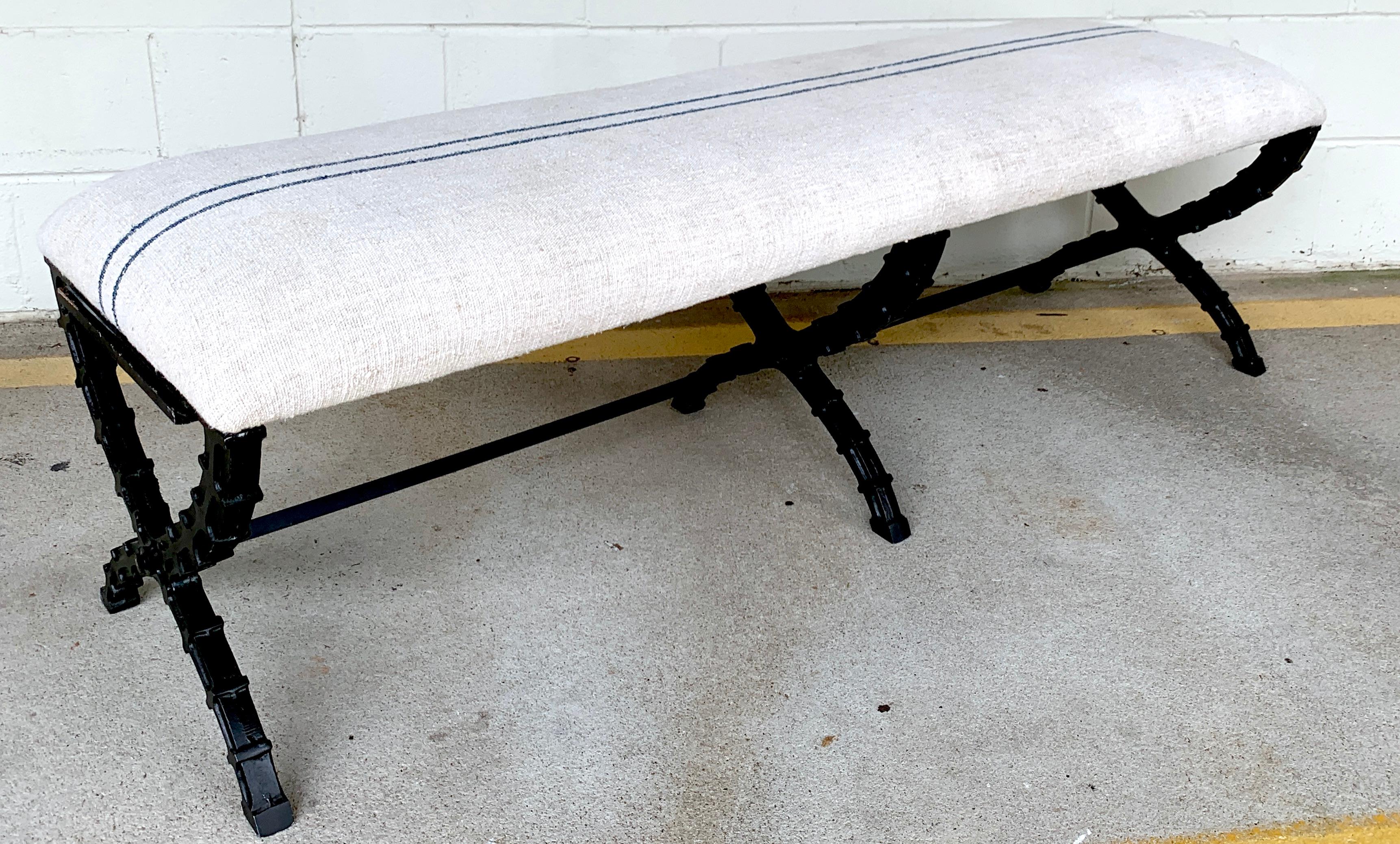 French Industrial X-stretcher long bench with blue stripe linen upholstery, recently upholstered. Raised on three X-stretchers.

 