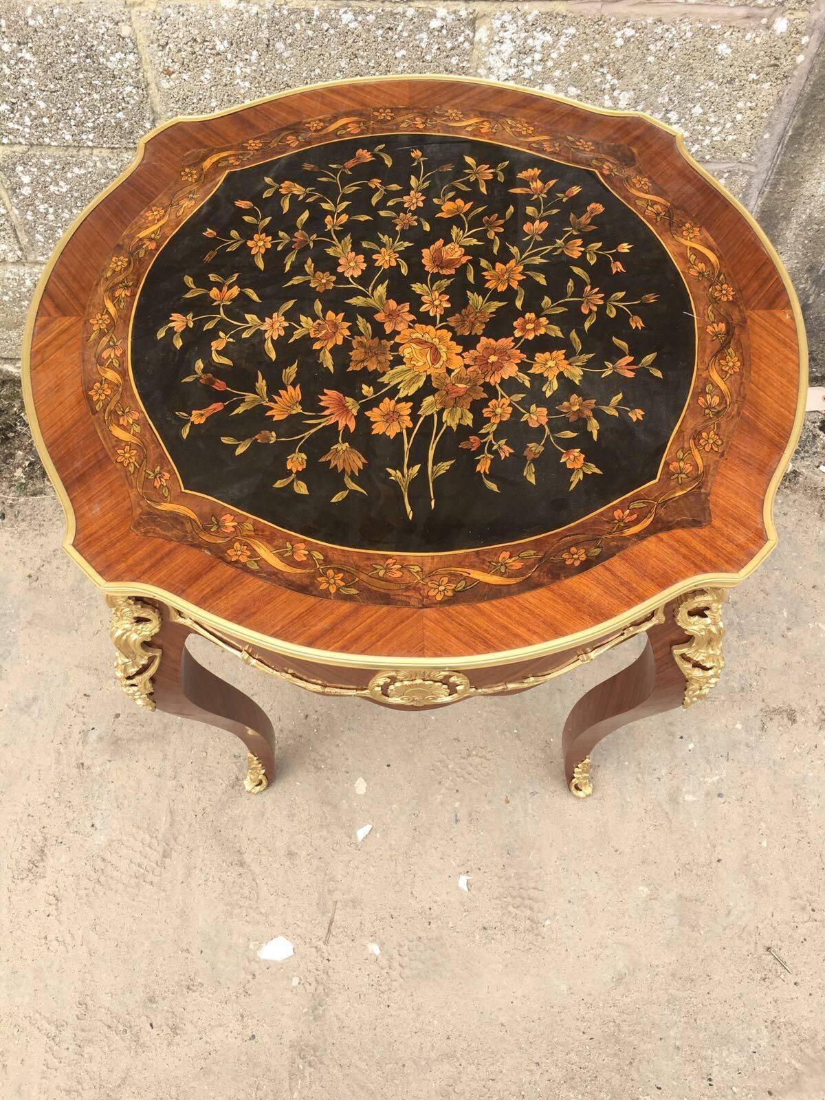This listing is for a lovely french inlaid side table. Nice bronze detailing, see all pictures listed.


Dimensions- 77cm wide and 80cm tall

 
See my other ads for more french furniture.