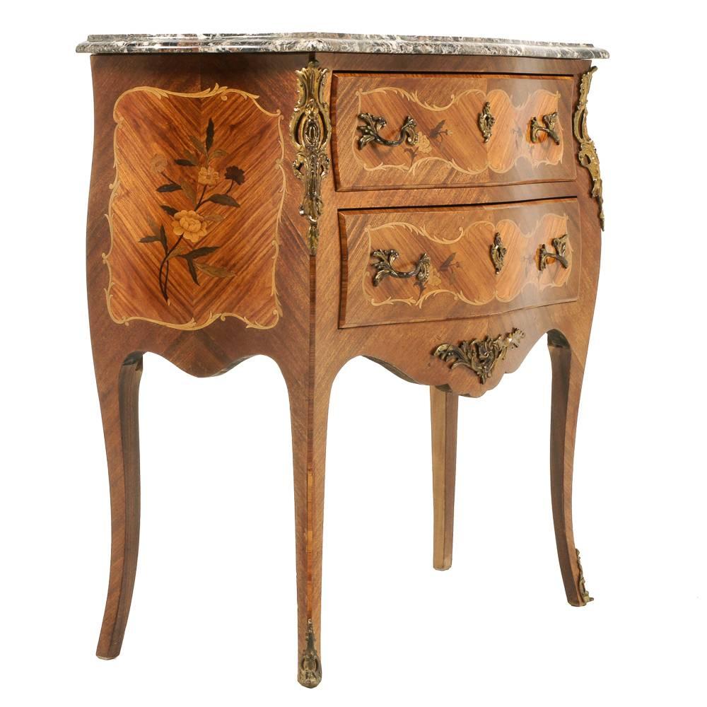 A small, marble-top, inlaid Louis XV-style, highly inlaid ‘bombe’ commode with gilt mounts, circa 1930.


 