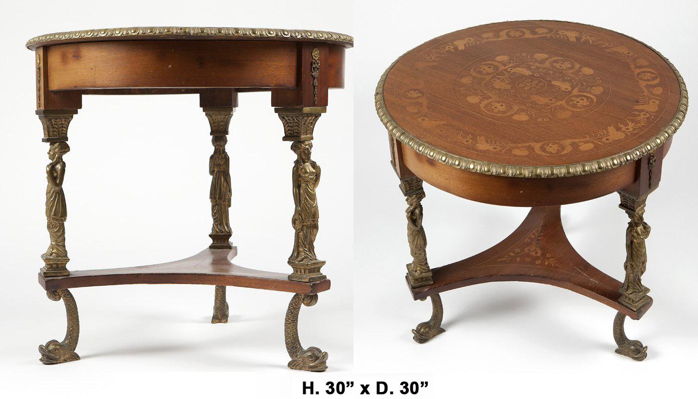 Beautiful French inlaid marquetry round table with bronze figures. 

The molded round top inlaid with a foliage and floral motif inset into a gilt bronze egg and dart border, supported by three classical Caryatids raised on a stepped base,