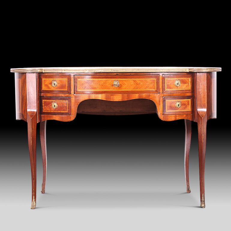 French inlaid kidney shaped desk with book-matched veneered panels and crossbanding. Finished on all sides. C. 1910 – 20.