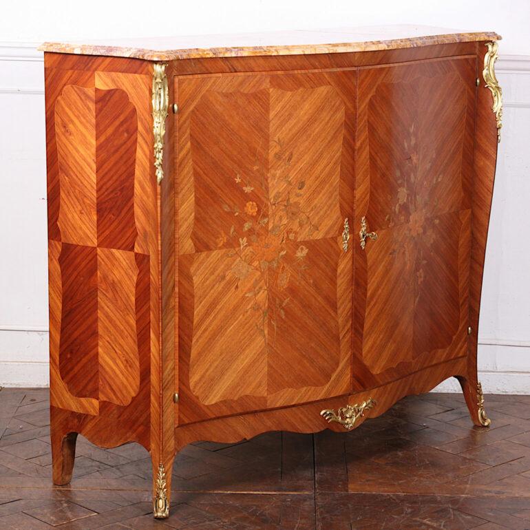  Vintage French two-door inlaid Louis XV style marble top cabinet with pretty floral inlay to the sides and doors and with finely-case and finished gilt bronze mounts. Original shaped marble top with rounded bullnose edge.  Interior with adjustable