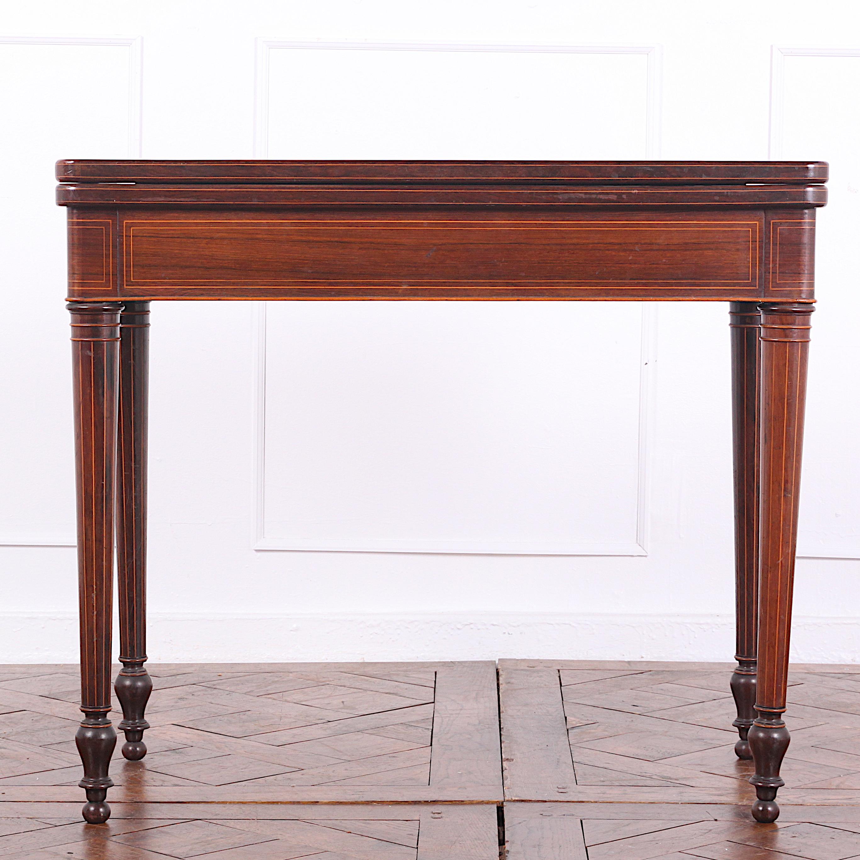 French rosewood Louis XVI games table with inlaid banding.