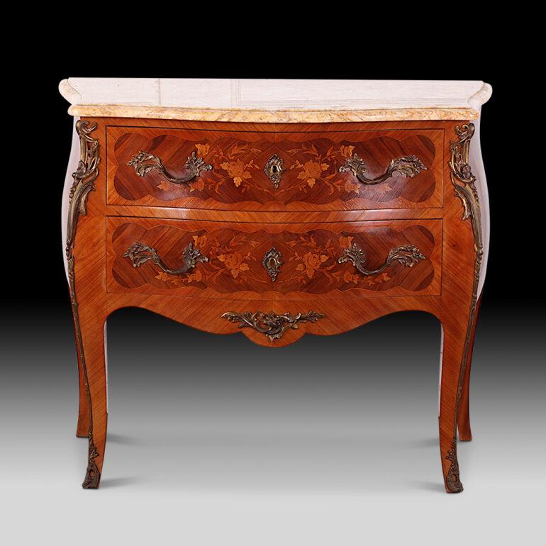 French Inlaid Louis XV Bombe commode with floral marquetry to the sides and drawers and with finely-cast and finished ormolu mounts and pulls. Original shaped marble top.


 
