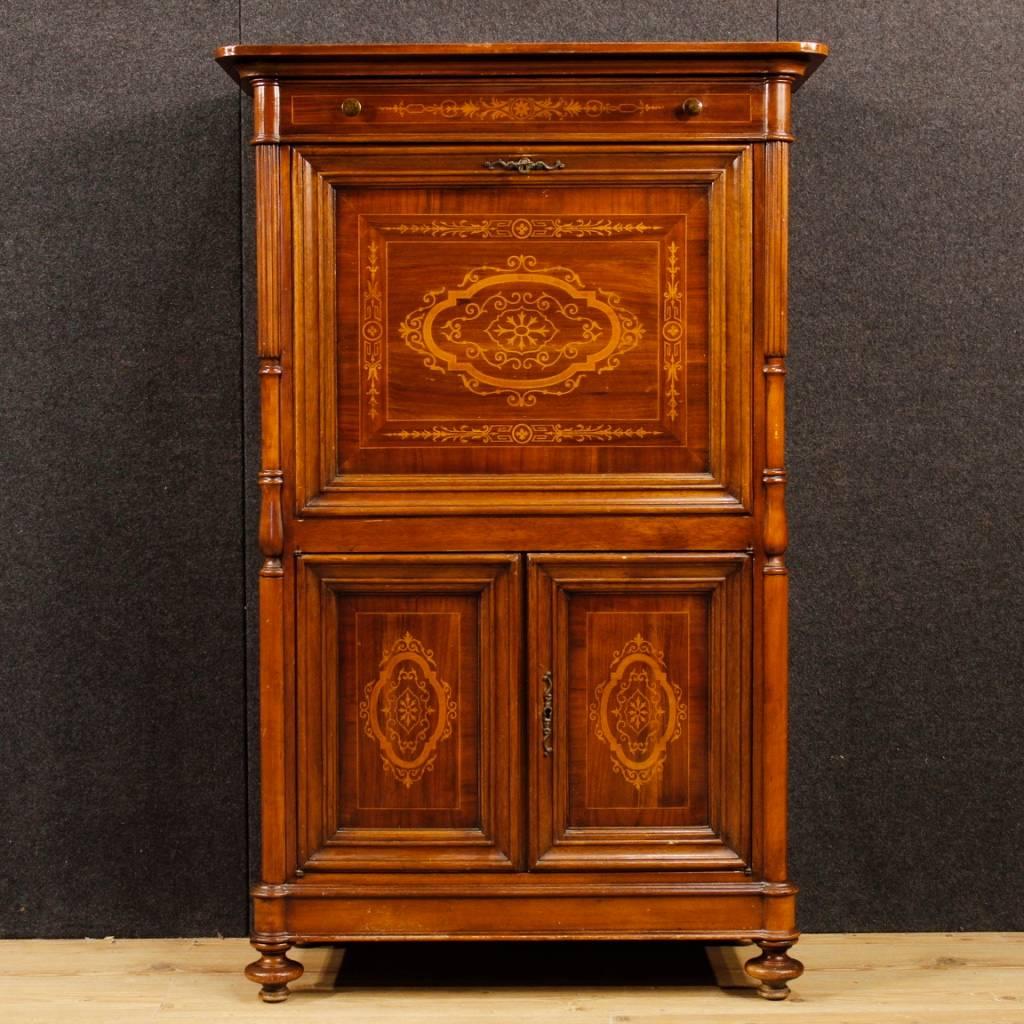 French secrétaire from 20th century. Furniture richly inlaid in walnut, mahogany and maple woods. Lower part with two doors with an internal shelf. Upper part with a drawer and fall-front writing desk with two drawers and document compartments