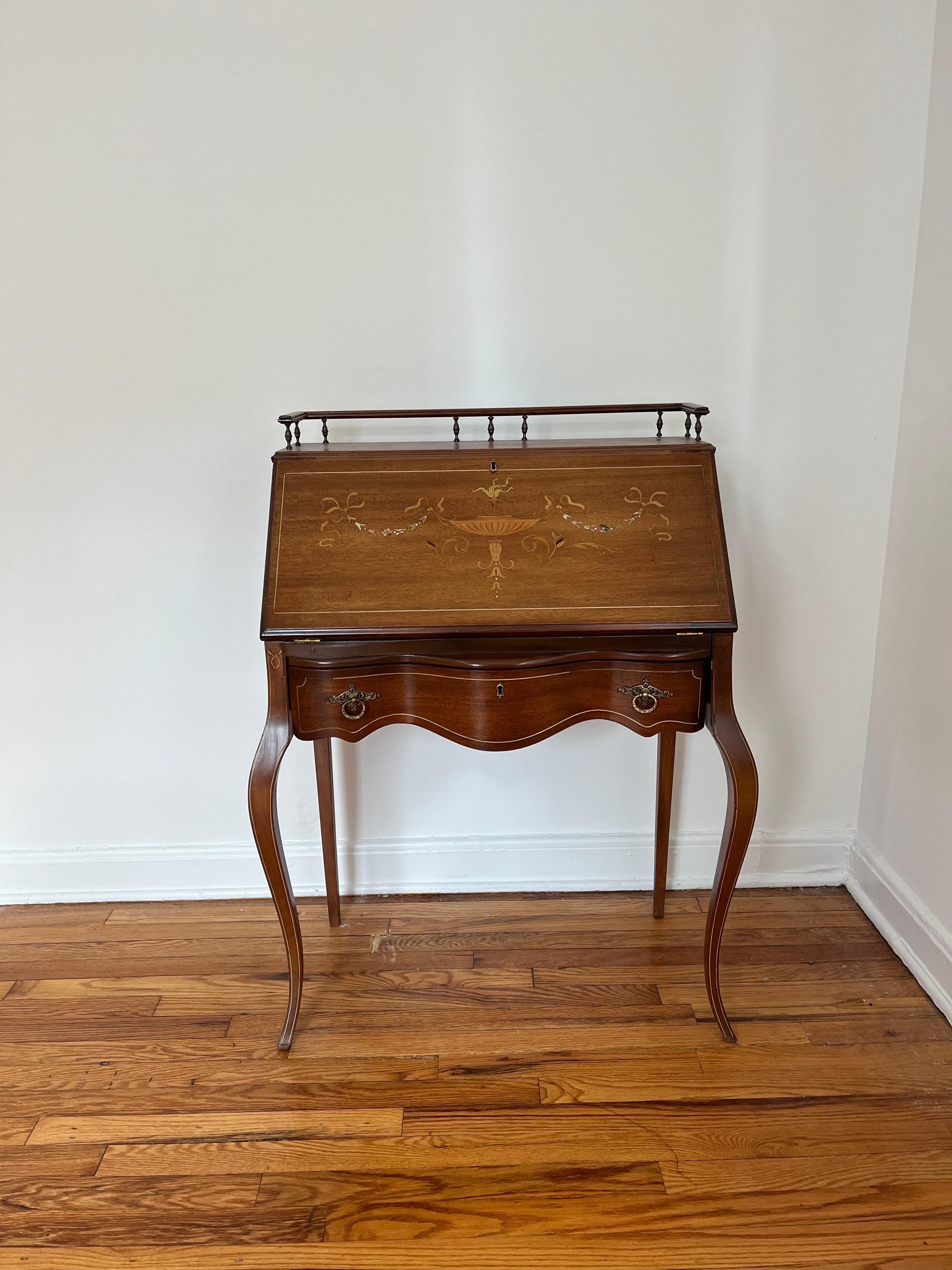 Early 20th C. Lady's Desk. Mahogany. Slant Lid Embellished With Mother-Of-Pearl And Colored Wood Inlay In Foliate Design.
Curbside to NYC/Philly $300