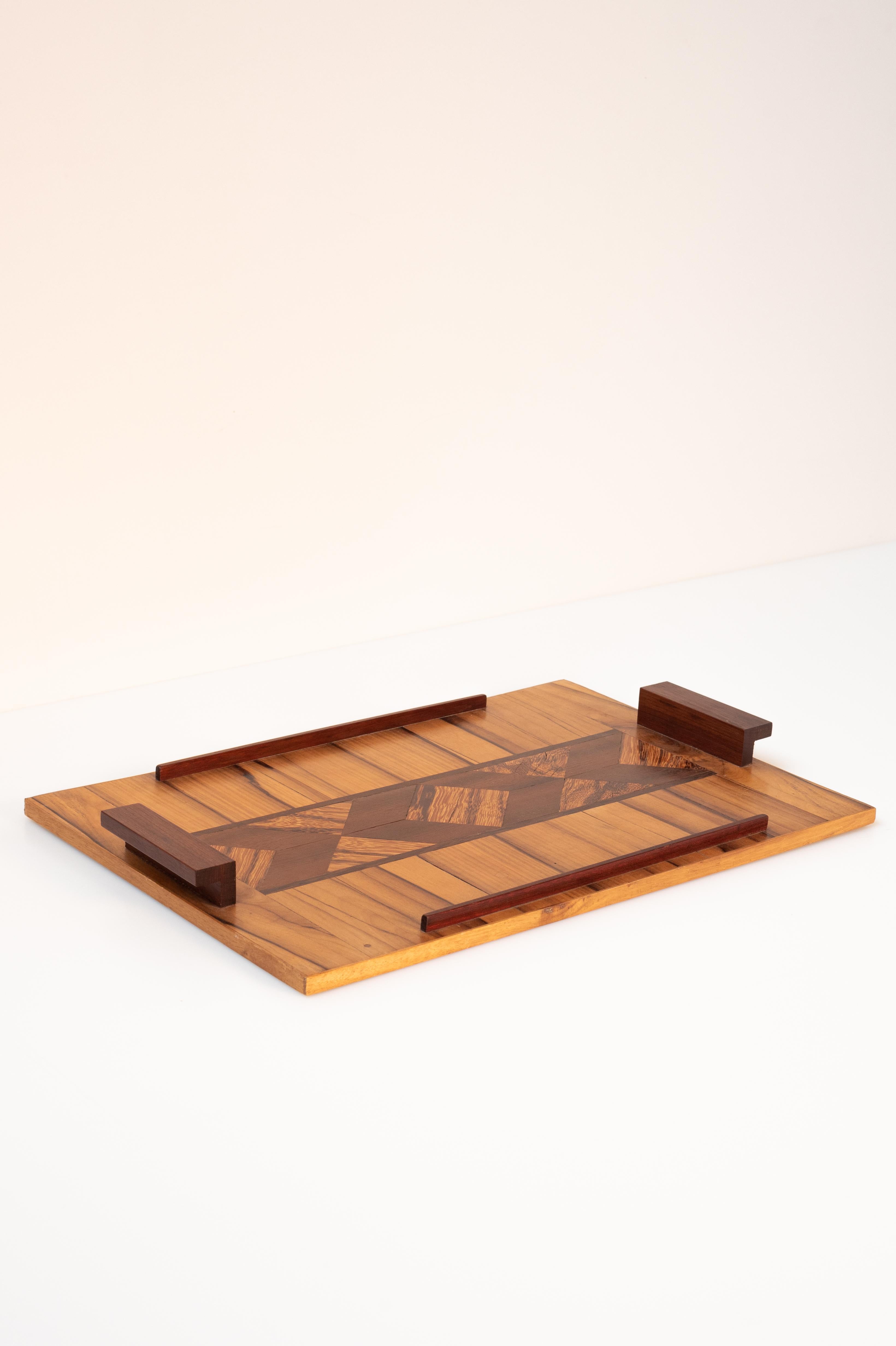 This French inlay wood marquetry serving tray is a beautiful piece of craftsmanship. It was made in France, in the period 1920-1940. 