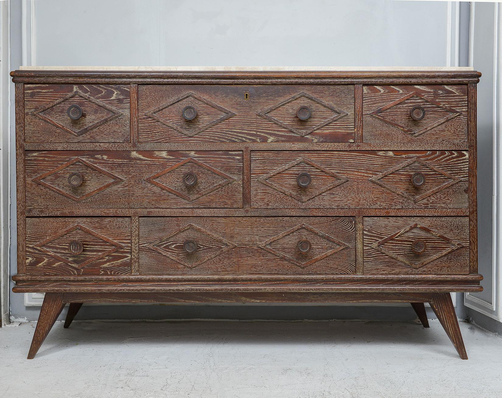 French-inspired Cerused Oak Chest/Cabinet in the Mid-Century style with a travertine top and multiple drawers.