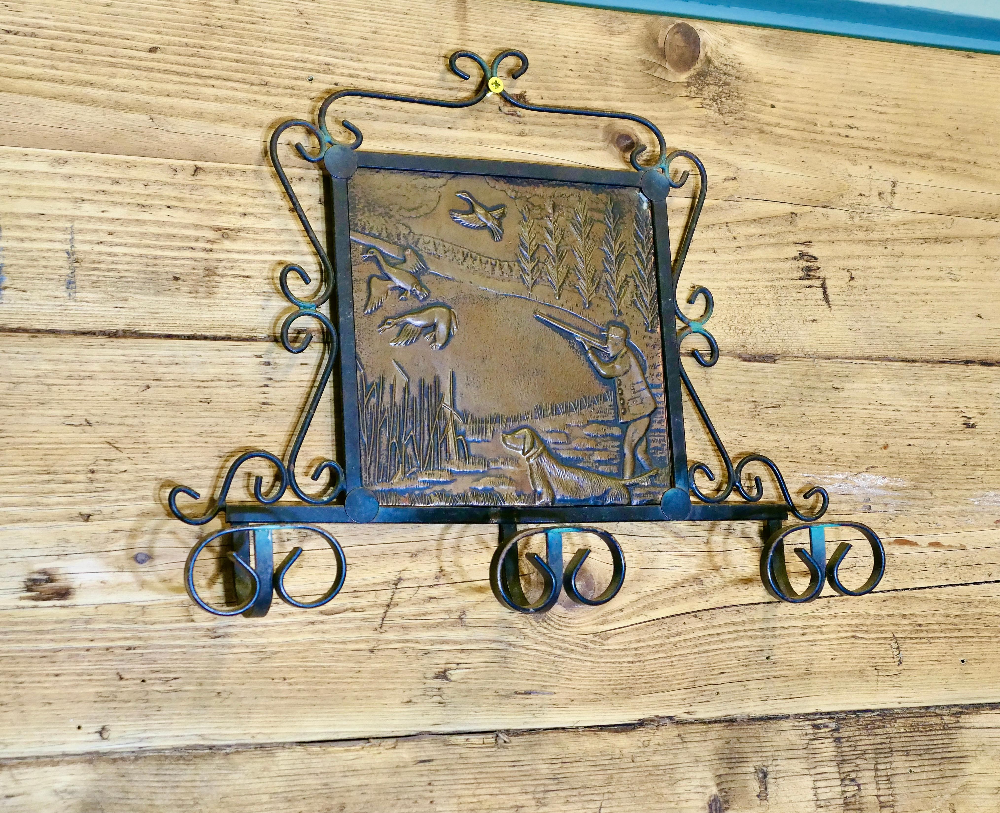 Early 20th Century French Iron and Copper Coat Hooks on a Hunting Theme For Sale