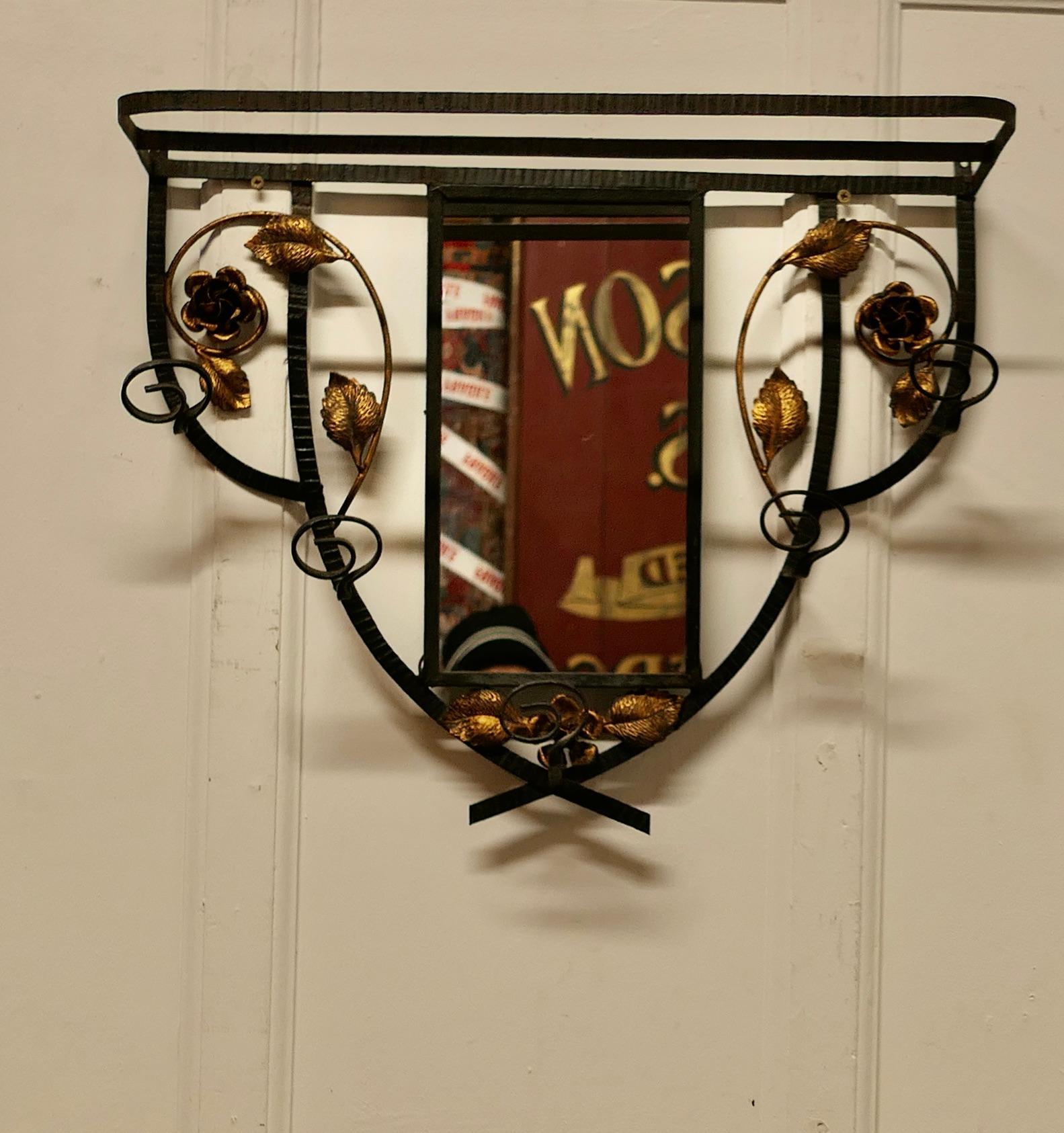 French Iron and Gilt Hall Coat Hooks with Mirror 

This is an attractive wall hanging shelf with 5 coat hooks, it has decorative gilt roast and leaf decoration and a central mirror
The Rack is 24” long, 19” high and 9” deep
TSC62