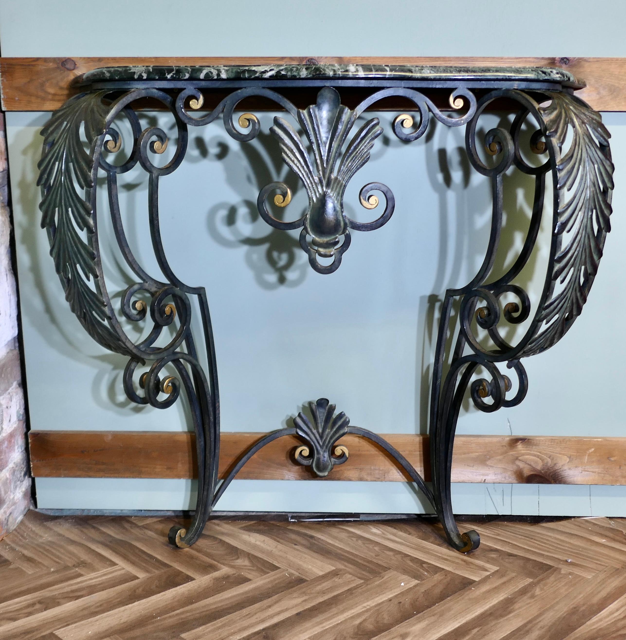 French Iron and Marble Console Table 

This is a magnificent table is wall fixed so it is very economical with space making it very suited to a hall. The base of the table is made in very decorative wrought iron painted in black with gold