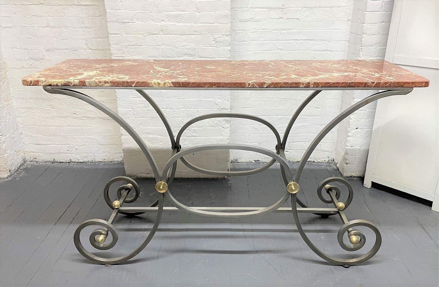 French, iron and marble-top console. Base has a nice, scrolled pattern with bronze round accents. Can also be used as a baker's table.