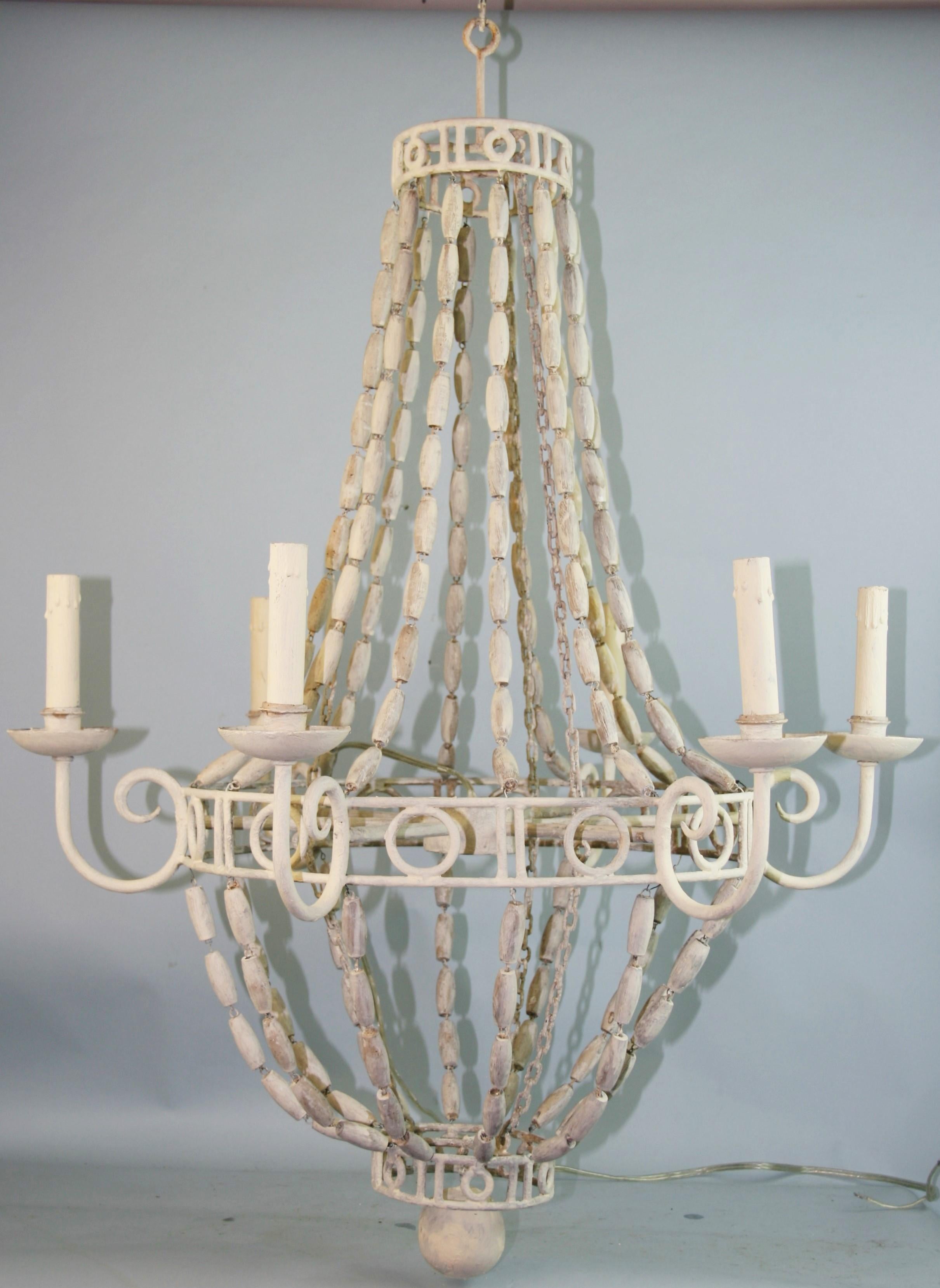 1257 French iron and wood bead country chandelier.