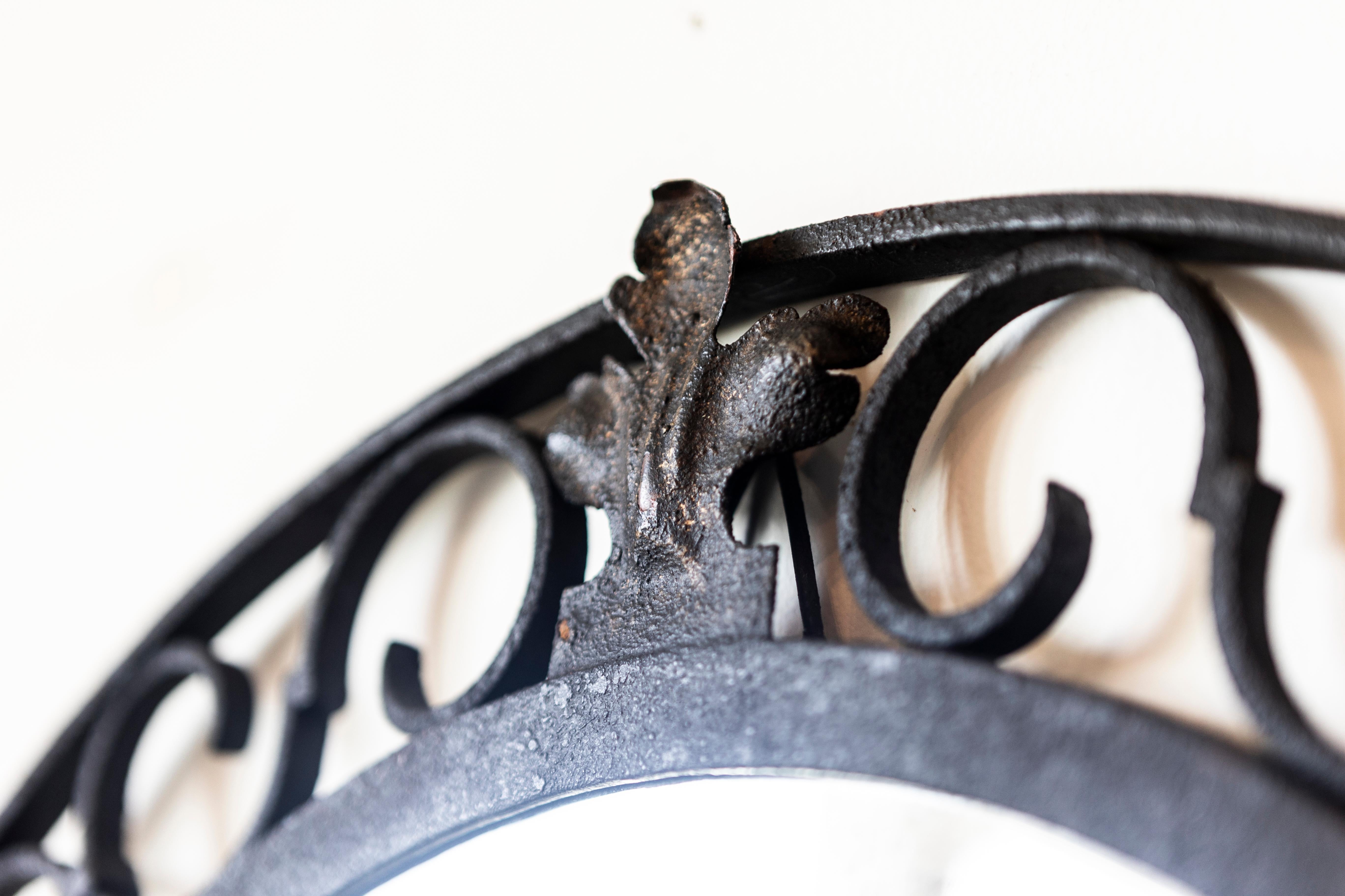 20th Century French Iron Arching Mirror with Openwork S-Scroll Motifs and Foliage Crest For Sale