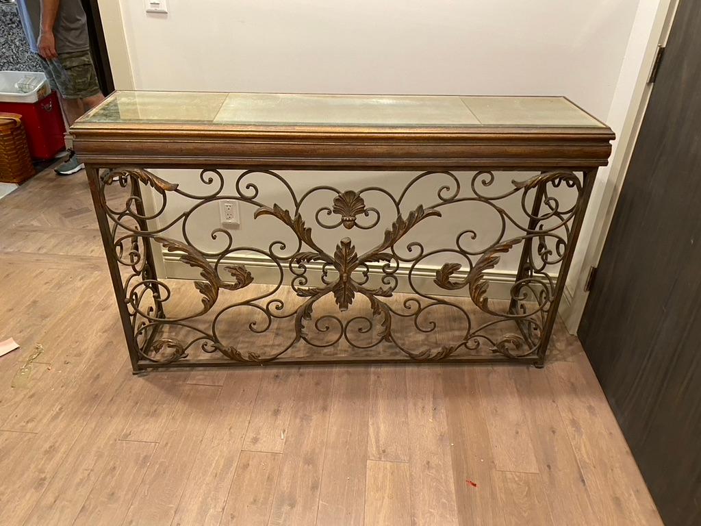 What a wonderful Credenza having an iron and brass base in full design and a mirrored top can be used in so many places.