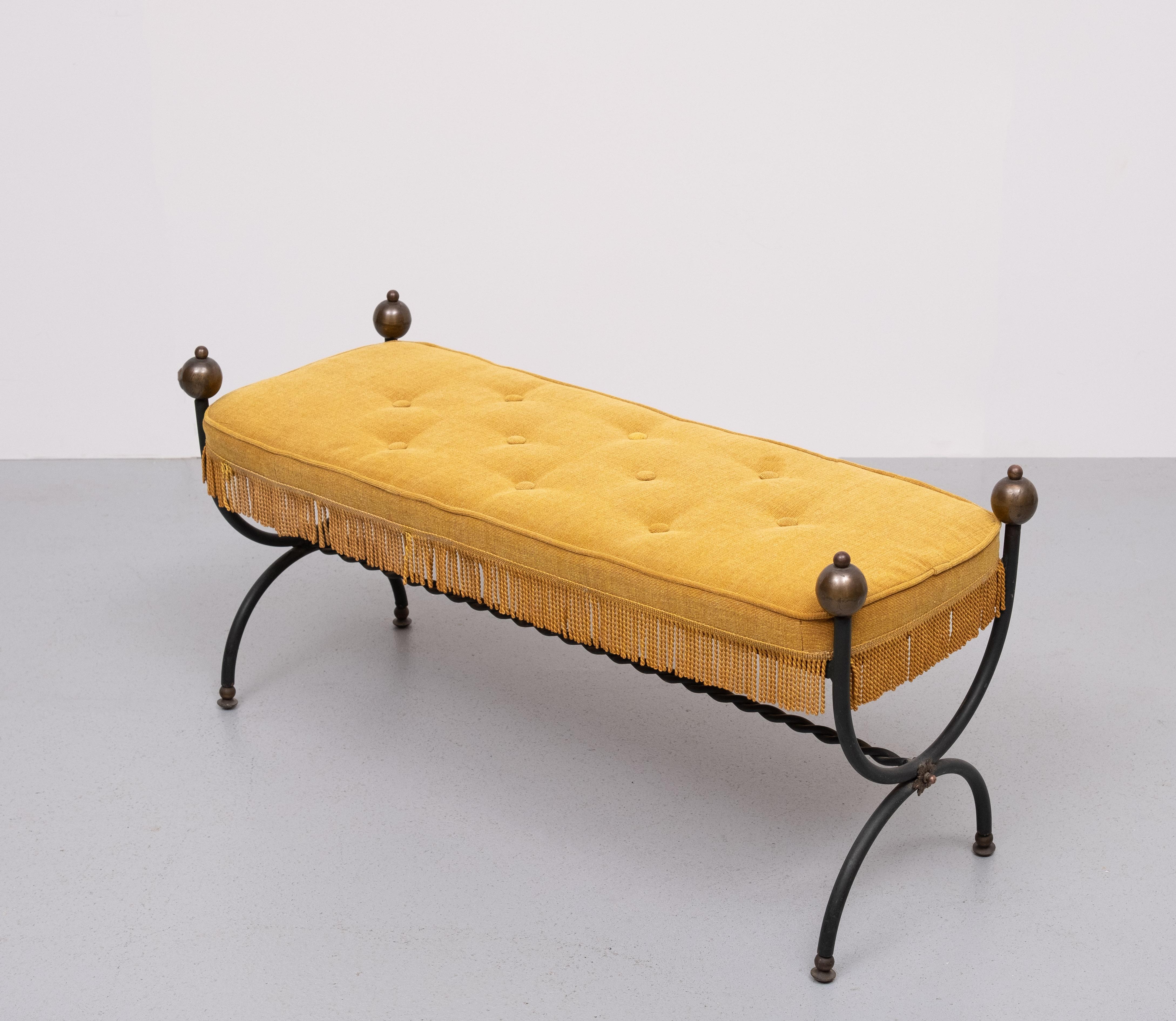 Gorgeous Yellow Fabric  and iron bench in the style of Maison Jansen, the pioneering French design firm of the early 20th century. The tufted cushion is brand new  and comfortable, the shape is curved at the corners to bypass the iron frame which is