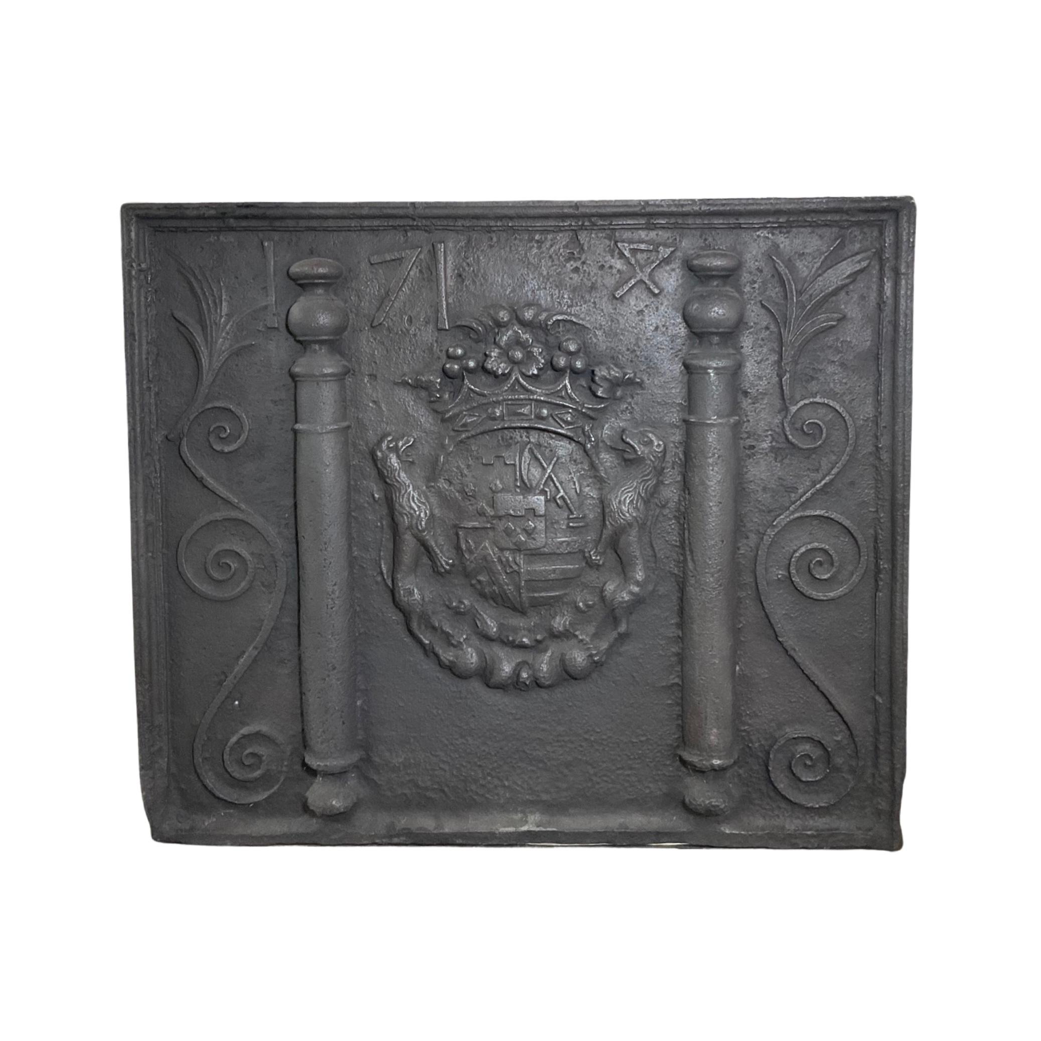 This antique fireback is a rare find from the 17th century. Hand-carved details give it unique character, and its French iron construction ensures durability. This piece is perfect for adding a touch of historical charm to your home.