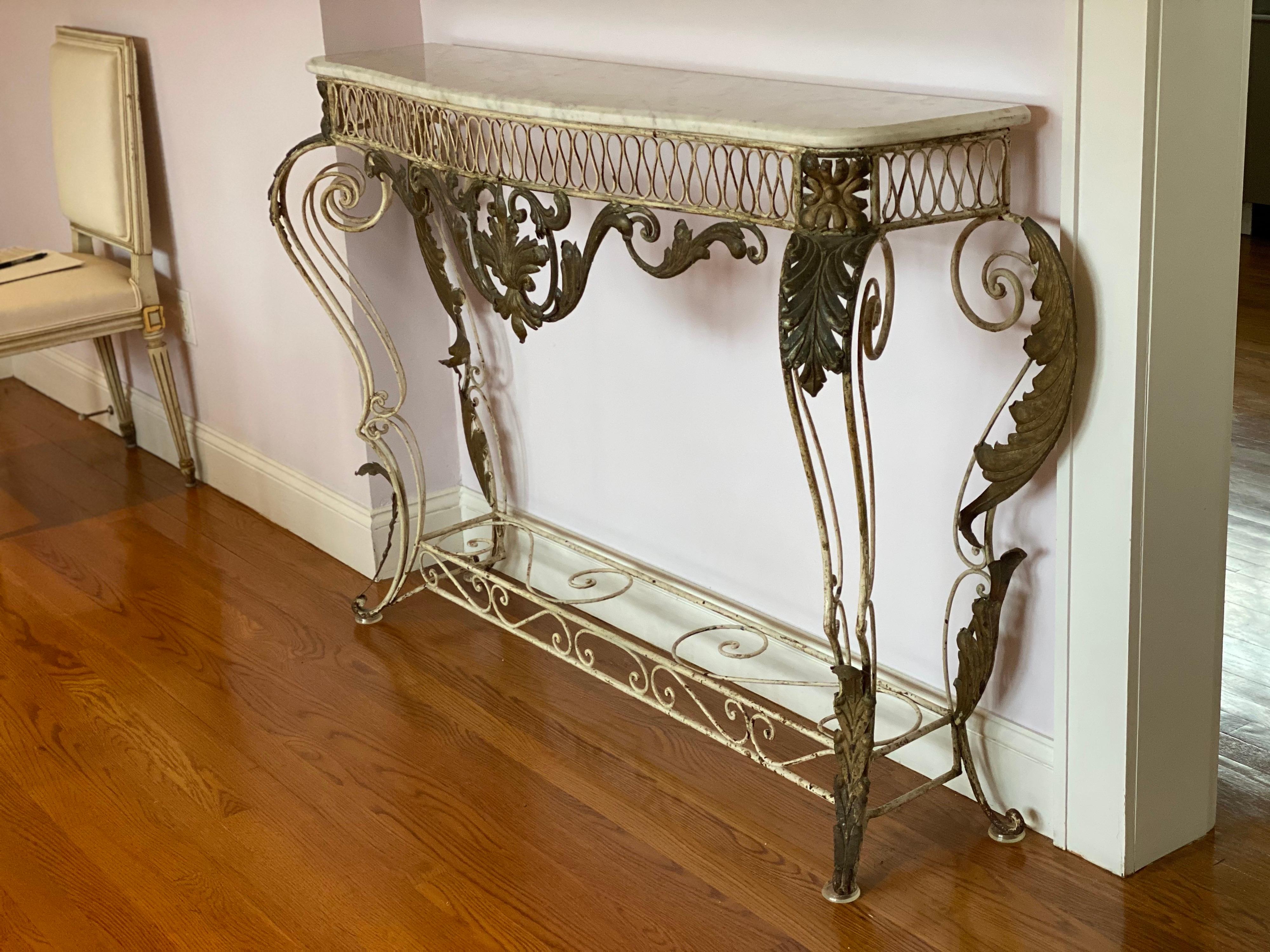 French iron & gilded Louis XV style white painted console with marble top
Elaborate scrolling ironwork with gilded acanthus leaves and Carrara marble top.
Measures: 60