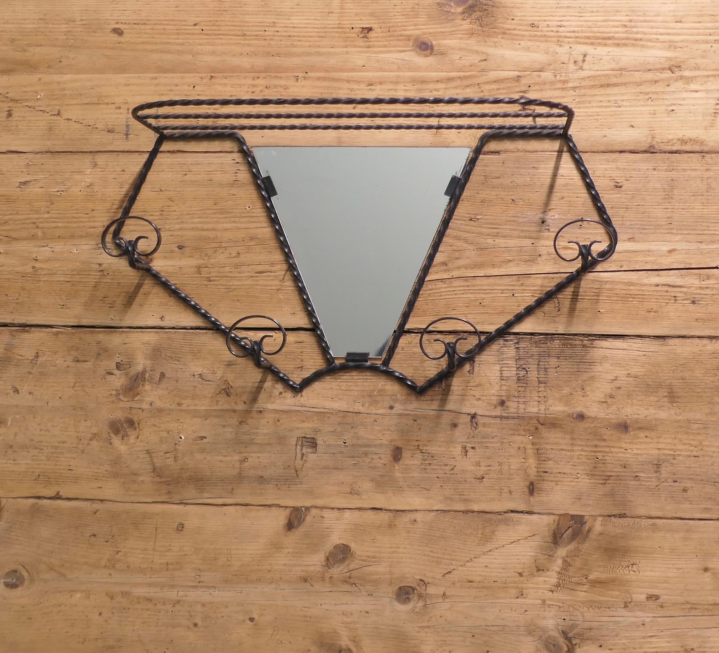 French Iron Hat and Coat Rack with Shelf & Mirror

This is a very stylish piece in wrought iron with a mirror at its centre, a shelf at the top and 4 Coat Hooks
This is a classic piece attractive and useful in hall, bathroom or cloakroom 
The rack