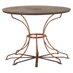 French iron octopus table C 1940 for the patio.
