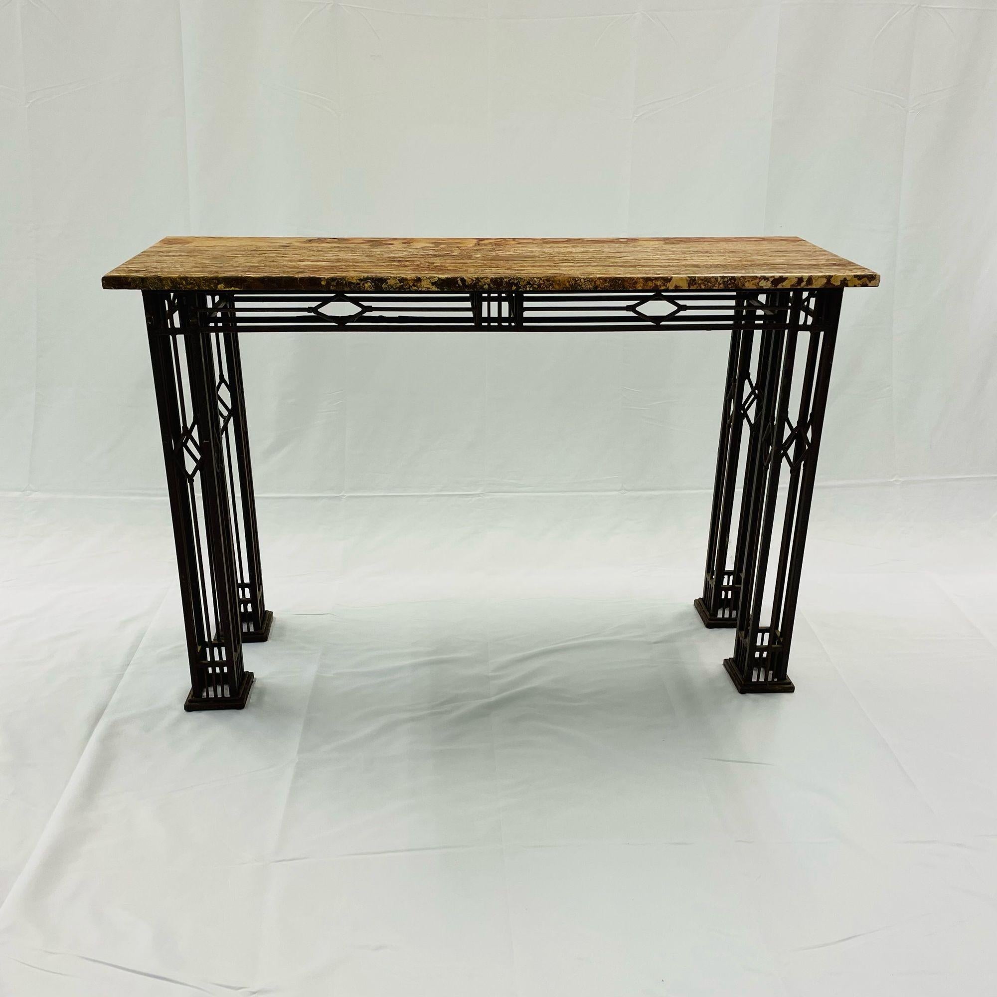 French Iron Work Console / Sofa Table, Marble Top
A finely cast table of console form having a marble top supported by a wrought iron base of mid century modern design. 
Wrought Iron, Marble
 
Base: 29H x 42W x 12D
Top: 30H x 45W x 15D.