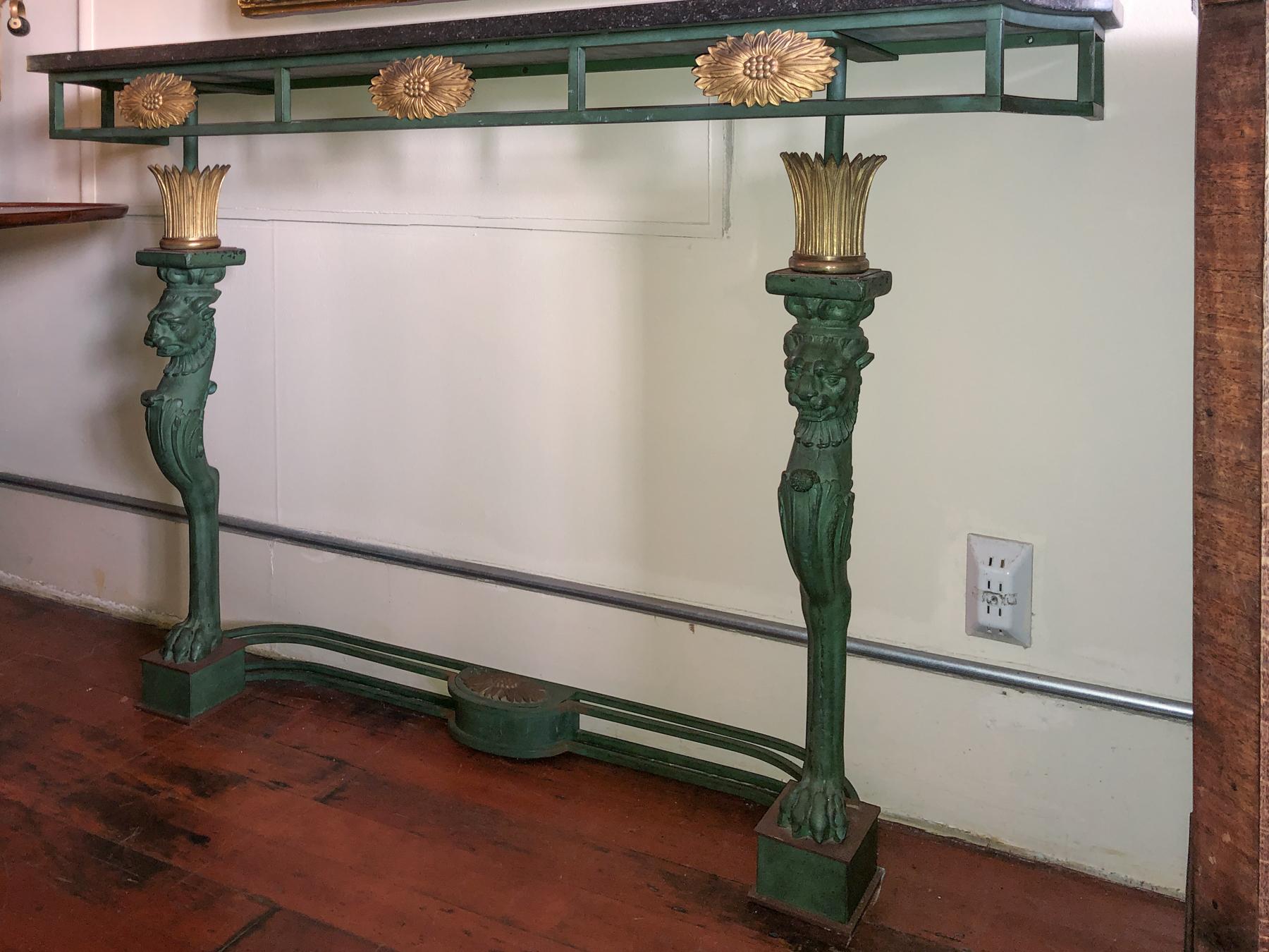 French Neoclassic // Directoire' Style Marble Top, Gilt Bronze & Iron Console Table.
Heavy solid iron base with green verdigris finish. Gilt bronze floral ovals below the top and crowns on top of the legs. One oval floral centered on the bottom