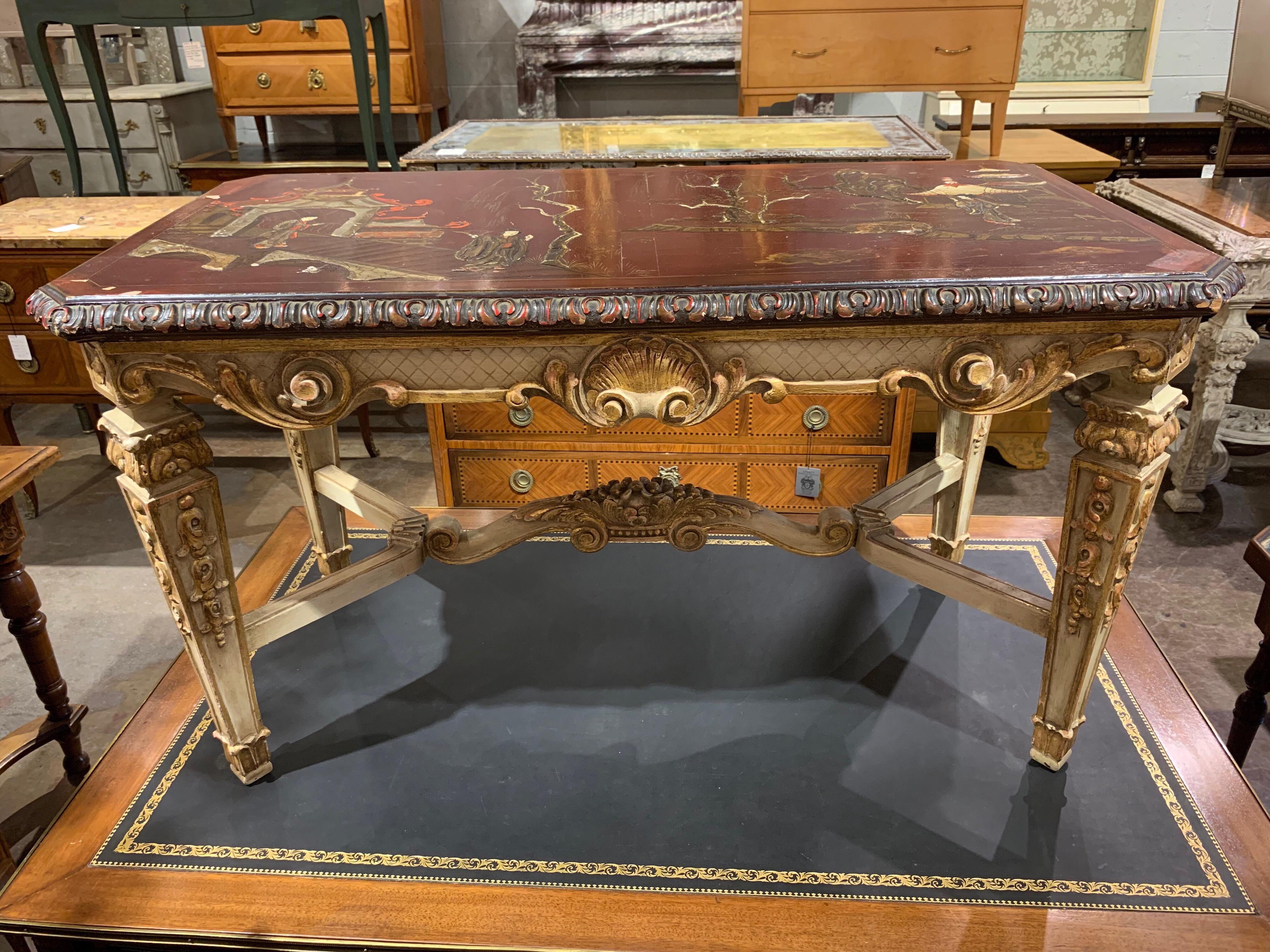 Very nice French Jansen carved gilt low table. Crisp carving and detail with well executed raised chinoiserie decoration on the top. Truly unique!