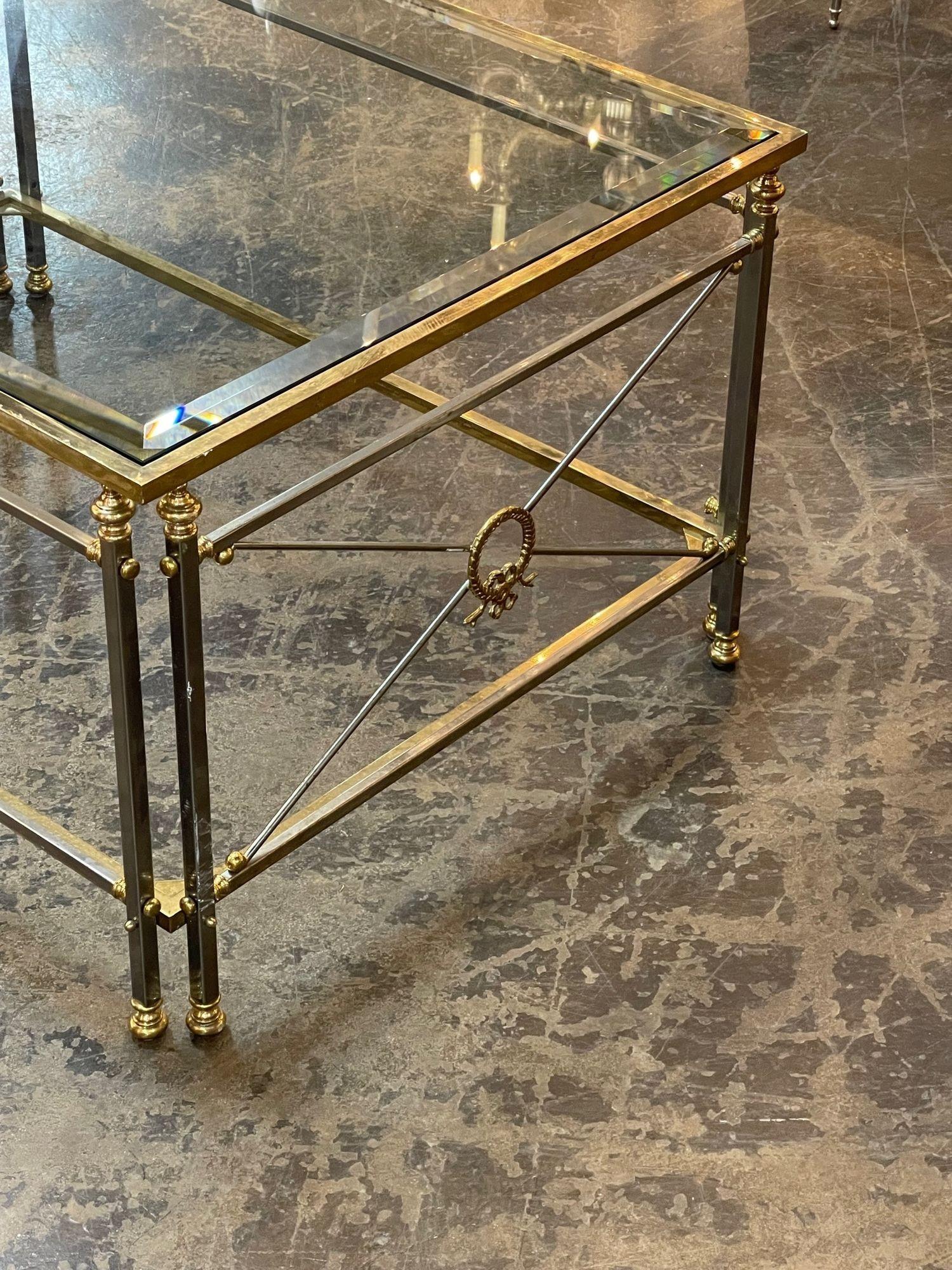 Vintage French Jansen style gilt brass and steel coffee table. Circa 1960. This is a favorite of top designers. A fine addition to any home!.