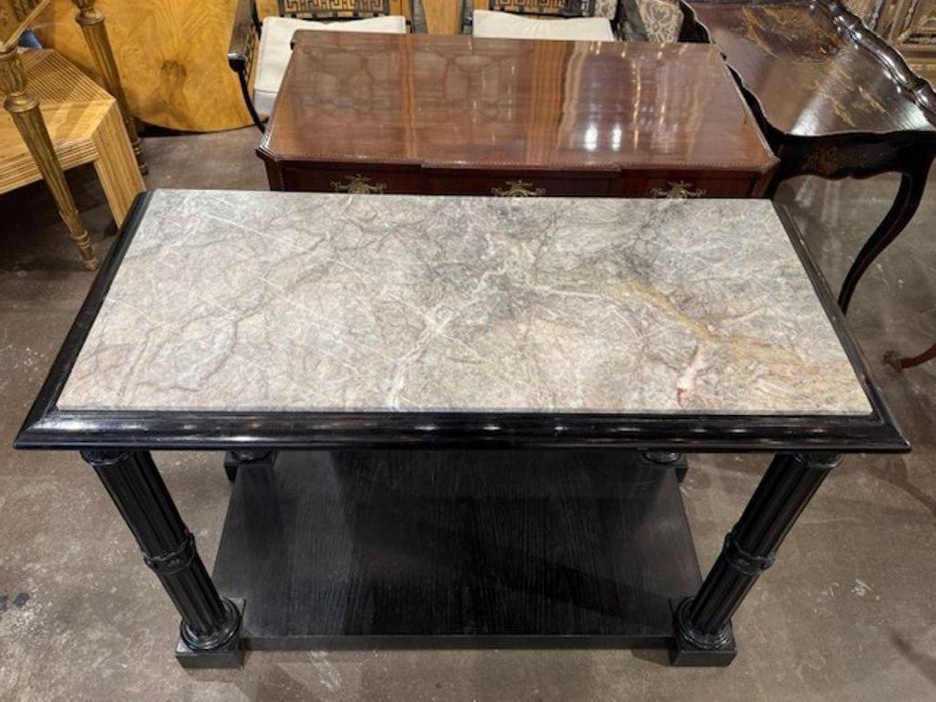 Consolas francesas estilo Jansen de roble lacado en negro con tapas de mármol siglo XX en venta
