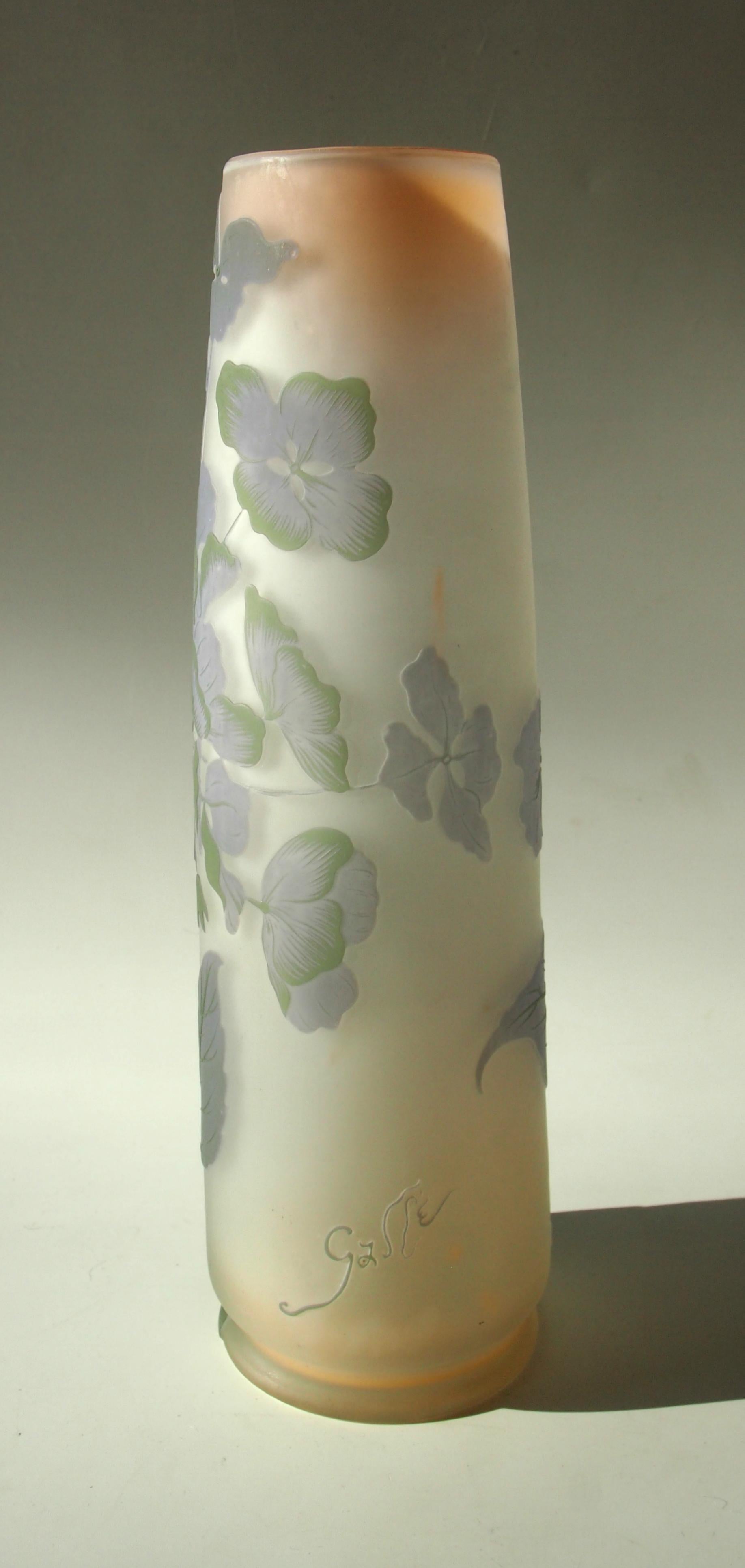 Superb Emile Galle cameo vase in the shape of an oversized Japanese brush pot. Four colors: Green, over purple, over opaque white, over clear with blush pink inside - depicting classic oriental style blossoms including falling blooms 'caught in mid
