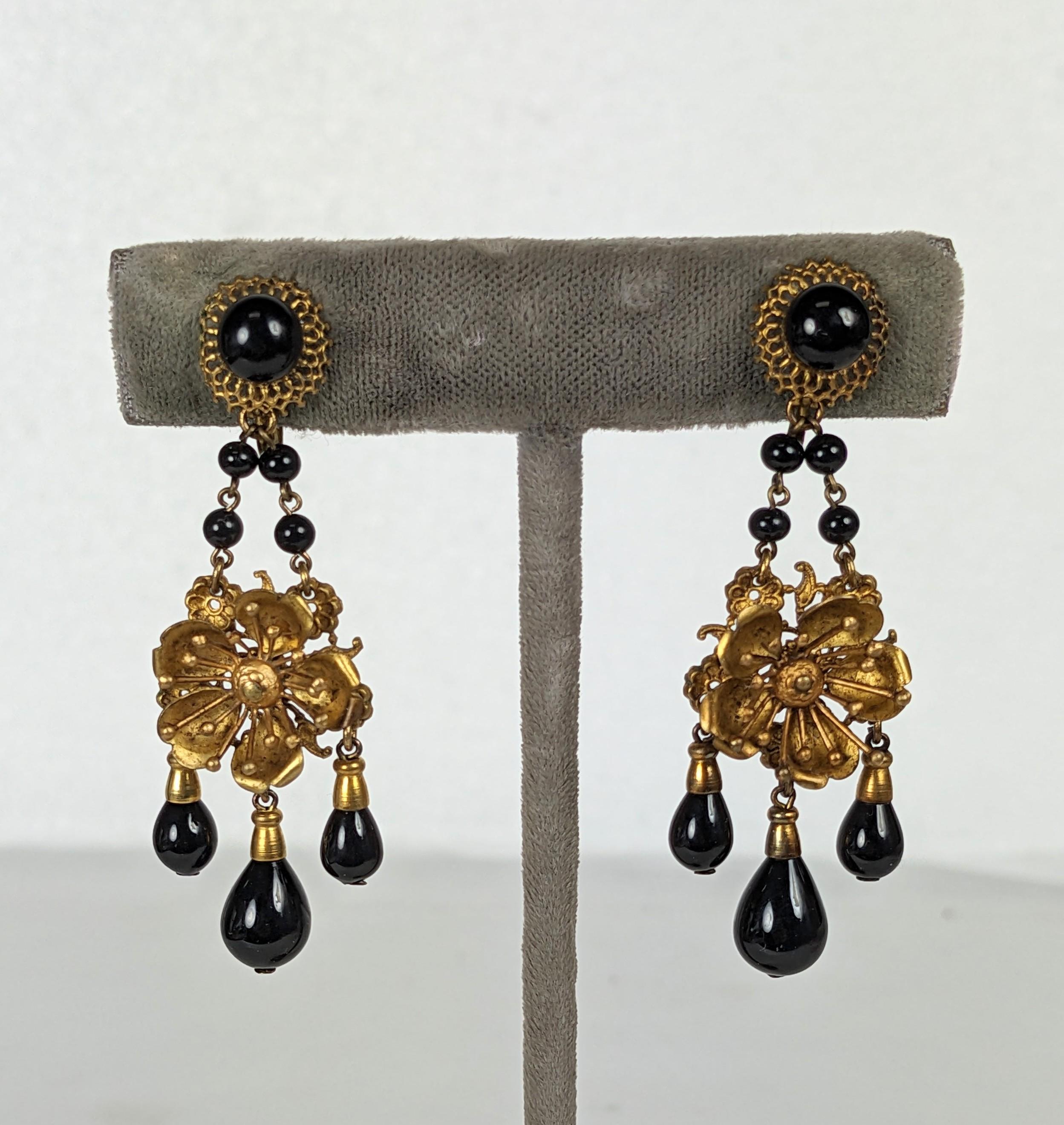 French Japonesque aesthetic movement girandole earrings. Of delicate Japanese three dimensional cherry blossom motifs in gilt metal. Jet pate de verre chain with three suspended pear shape pendant drops. Marked Made in France and  with additional