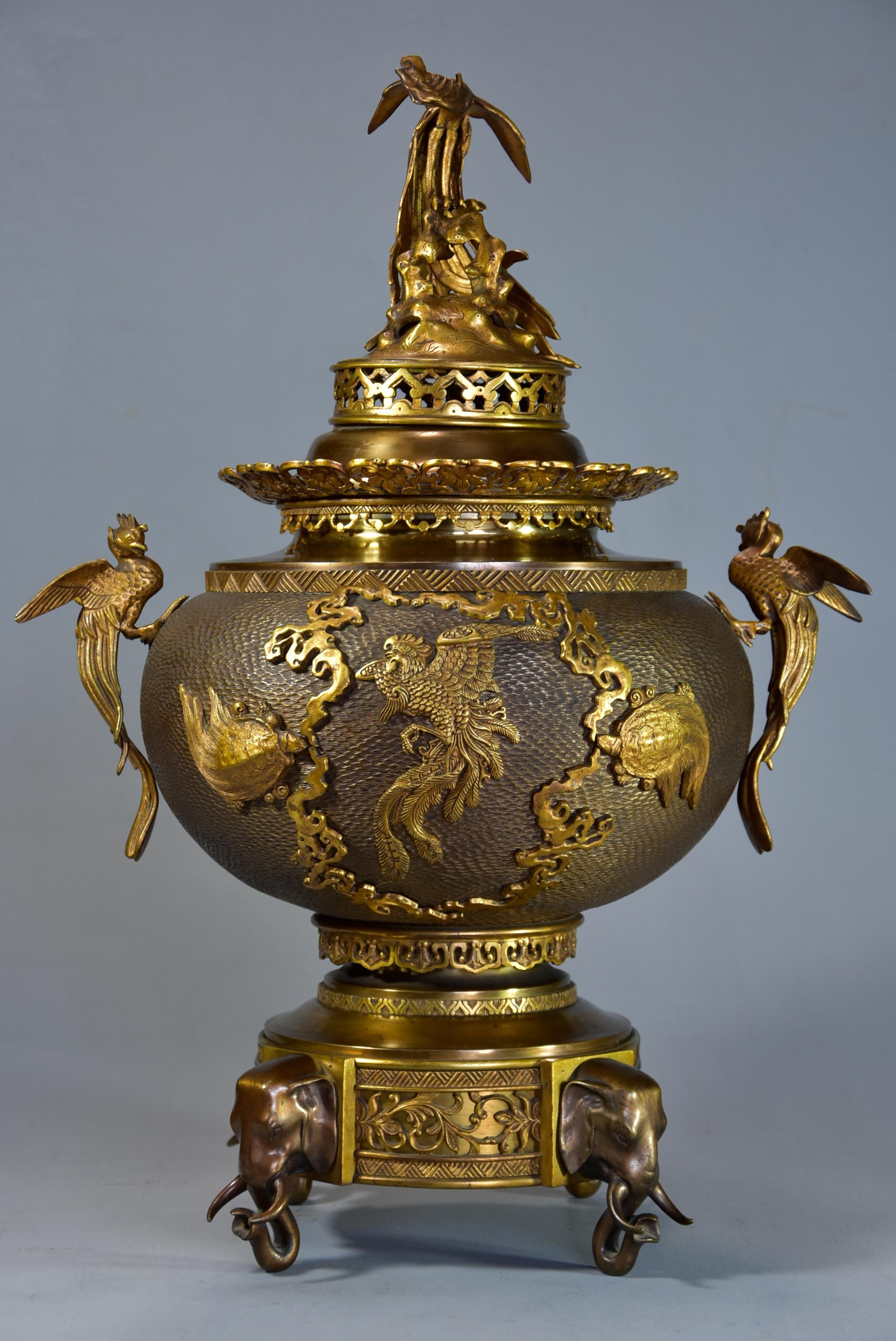 A fine quality late 19th century French Japonism style gilt and patinated bronze incense burner three piece set.

This superb set consists of an incense burner (or koro) with gilt bronze pierced lid with bird decoration and pieced rim
