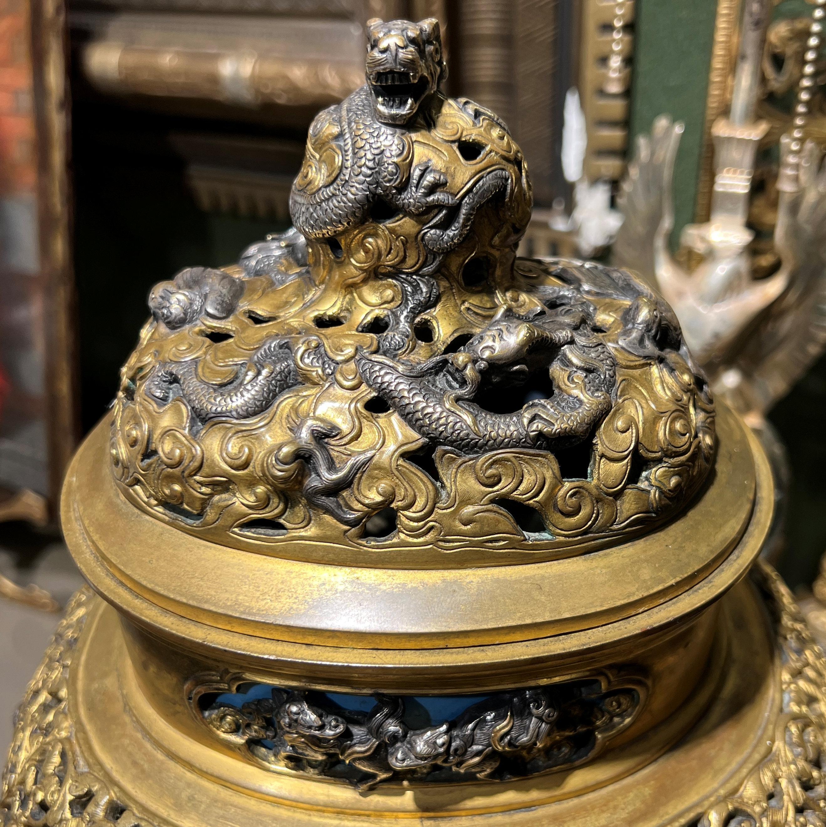 Our mantel clock and candelabra with silvered, gilt and cloisonne enamel surfaces in the French Japonisme style dates from the 1870s and is in good condition. Attributed to the influential and revered designer, Edouard Lievre (1828-1886), likely for